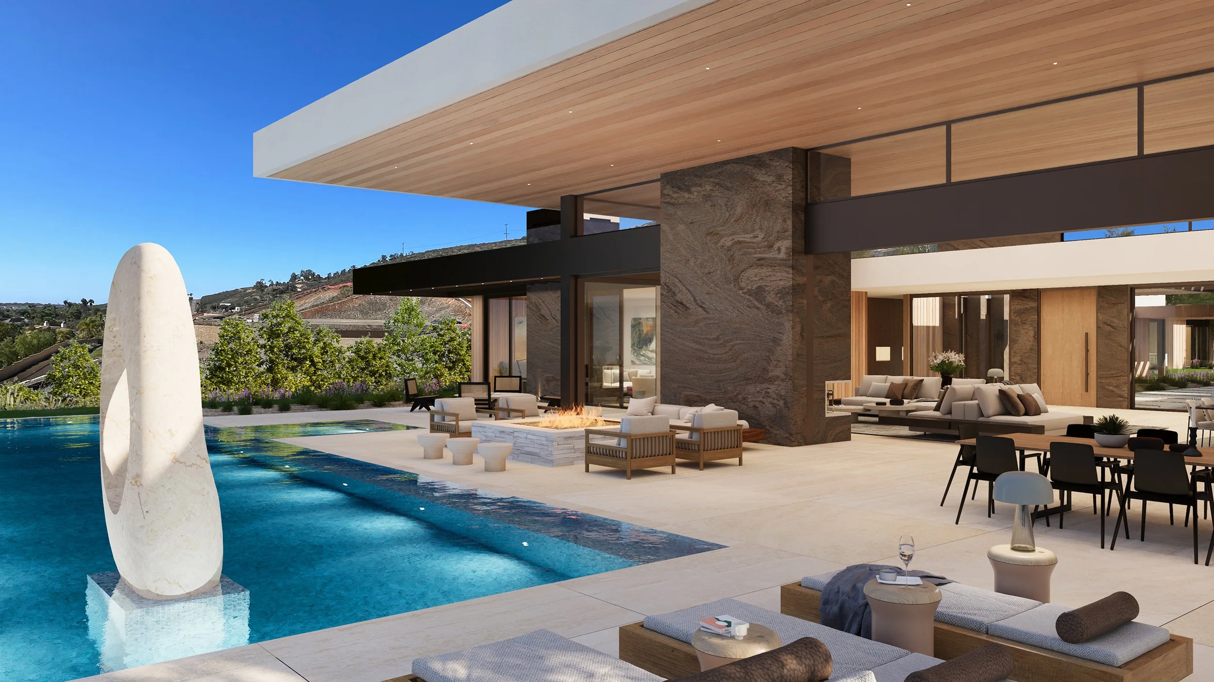 Rancho Santa Fe resort style luxury home in San Diego, California, with modern indoor outdoor design that opens onto a spacious backyard pool terrace.