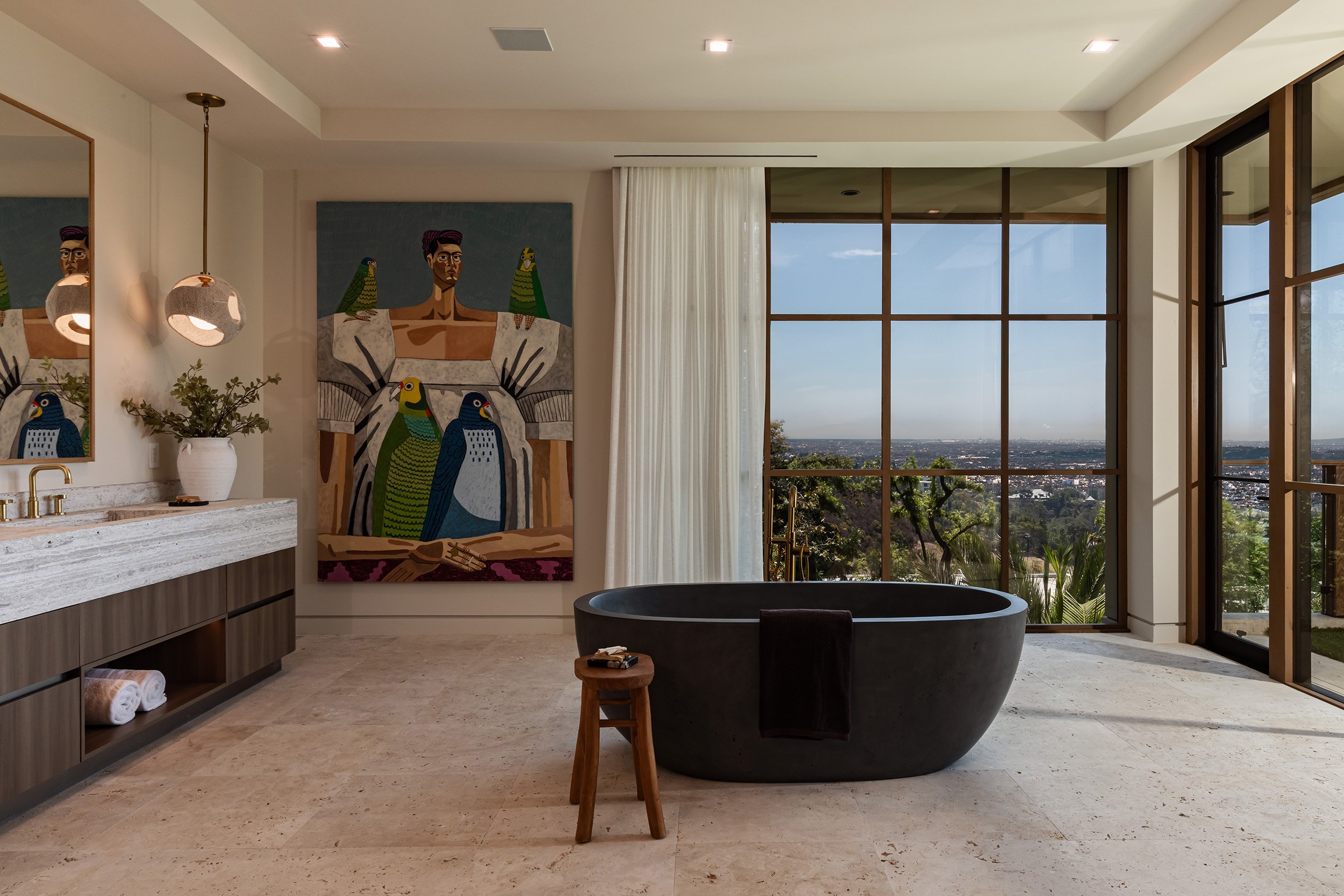 Franklin Canyon Beverly Hills luxury mansion modern primary bathroom with black freestanding soaking tub & views