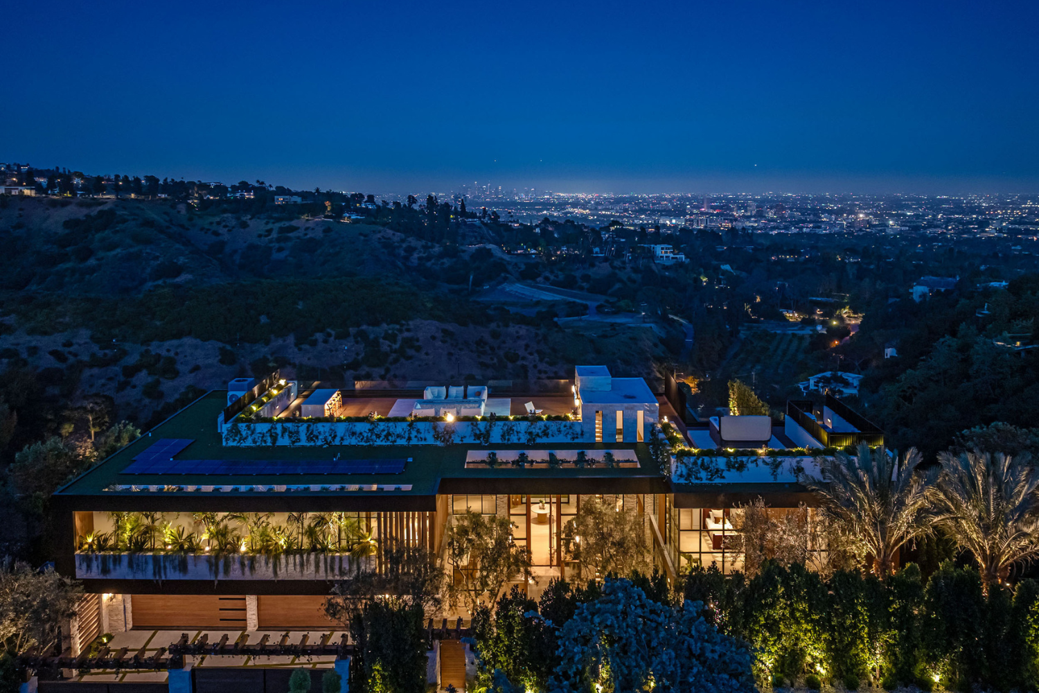 Beverly Crest luxury Beverly Hills mansion at night with rooftop terrace and views