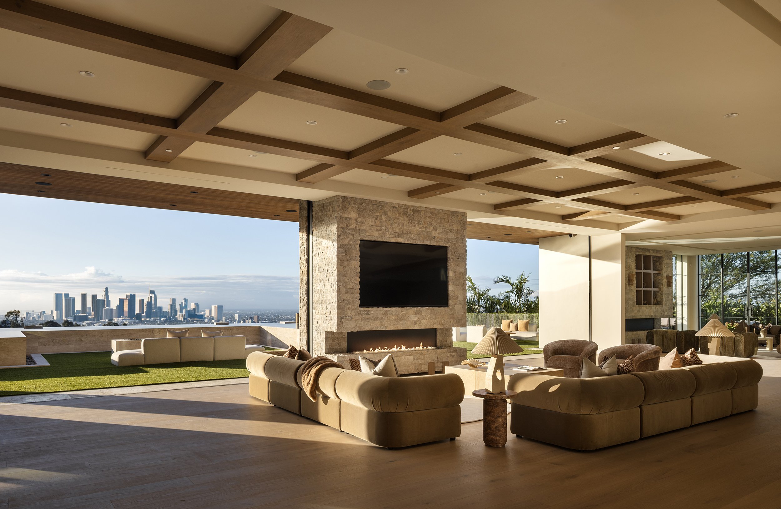 Laurel House Beverly Hills luxury home modern indoor outdoor living room & backyard terrace with jetliner LA city views
