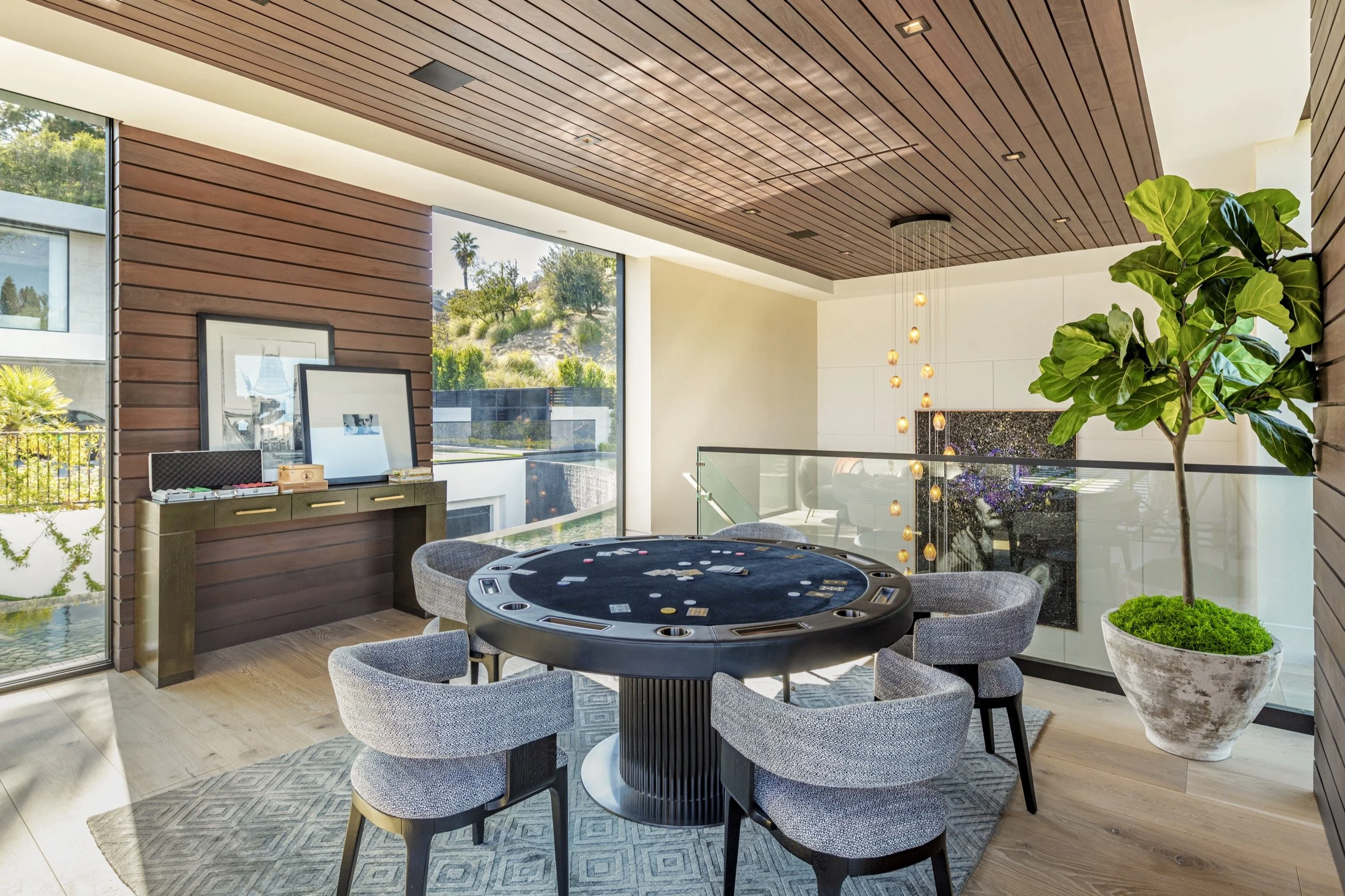 Natural light filled game room with poker table at our Bundy Drive house in Brentwood, Los Angeles
