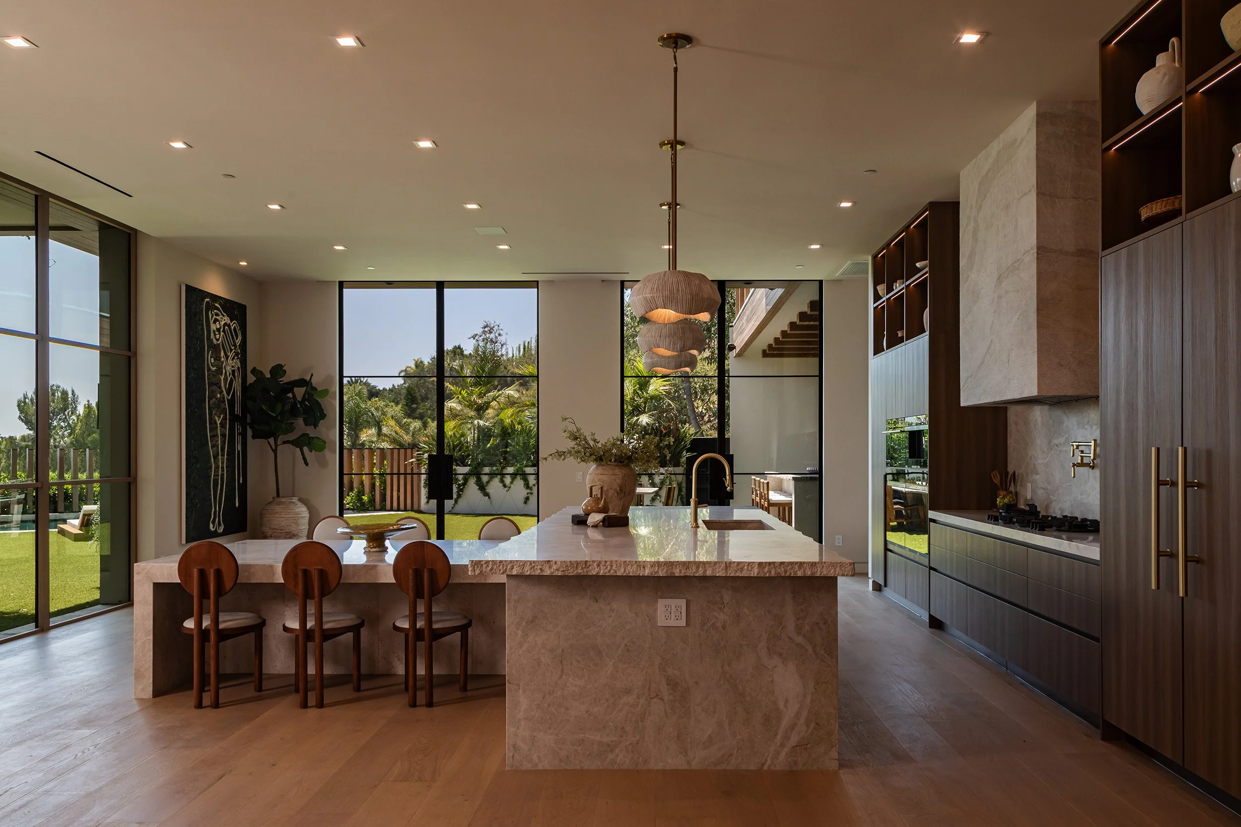 Franklin Canyon Beverly Hills luxury home modern kitchen with breakfast table & backyard views