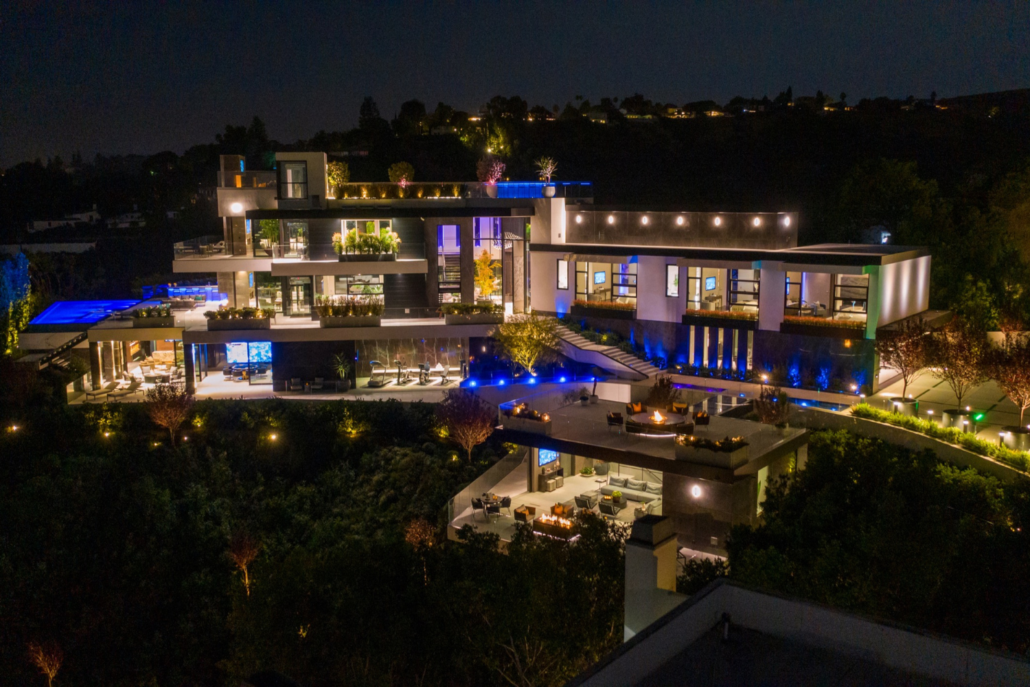 Summitridge Drive luxury Beverly Hills mansion with indoor outdoor modern architectural design and outdoor terraces