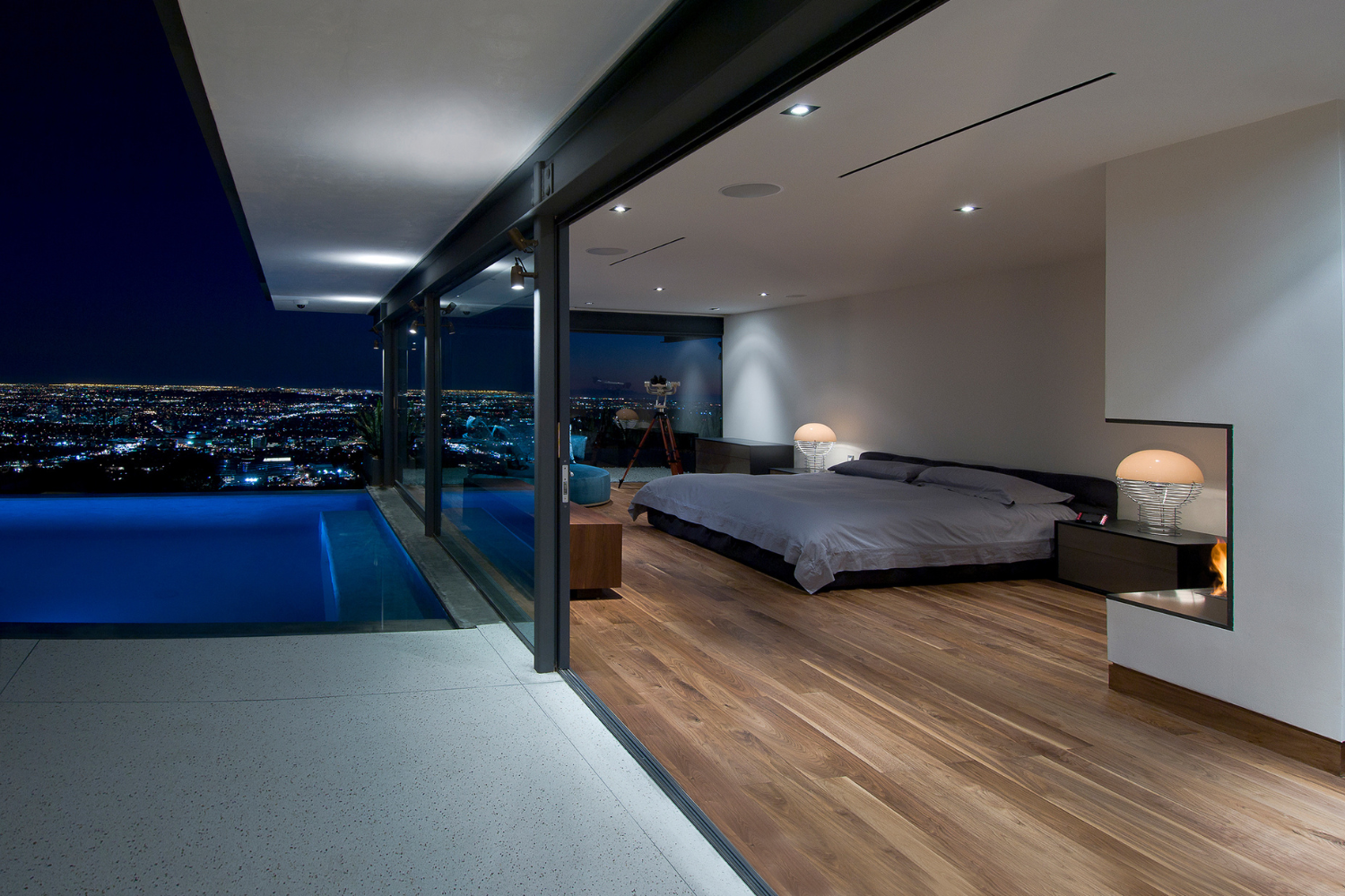 Hopen Place luxury modern Hollywood Hills home with glass walls & sweeping Los Angeles views