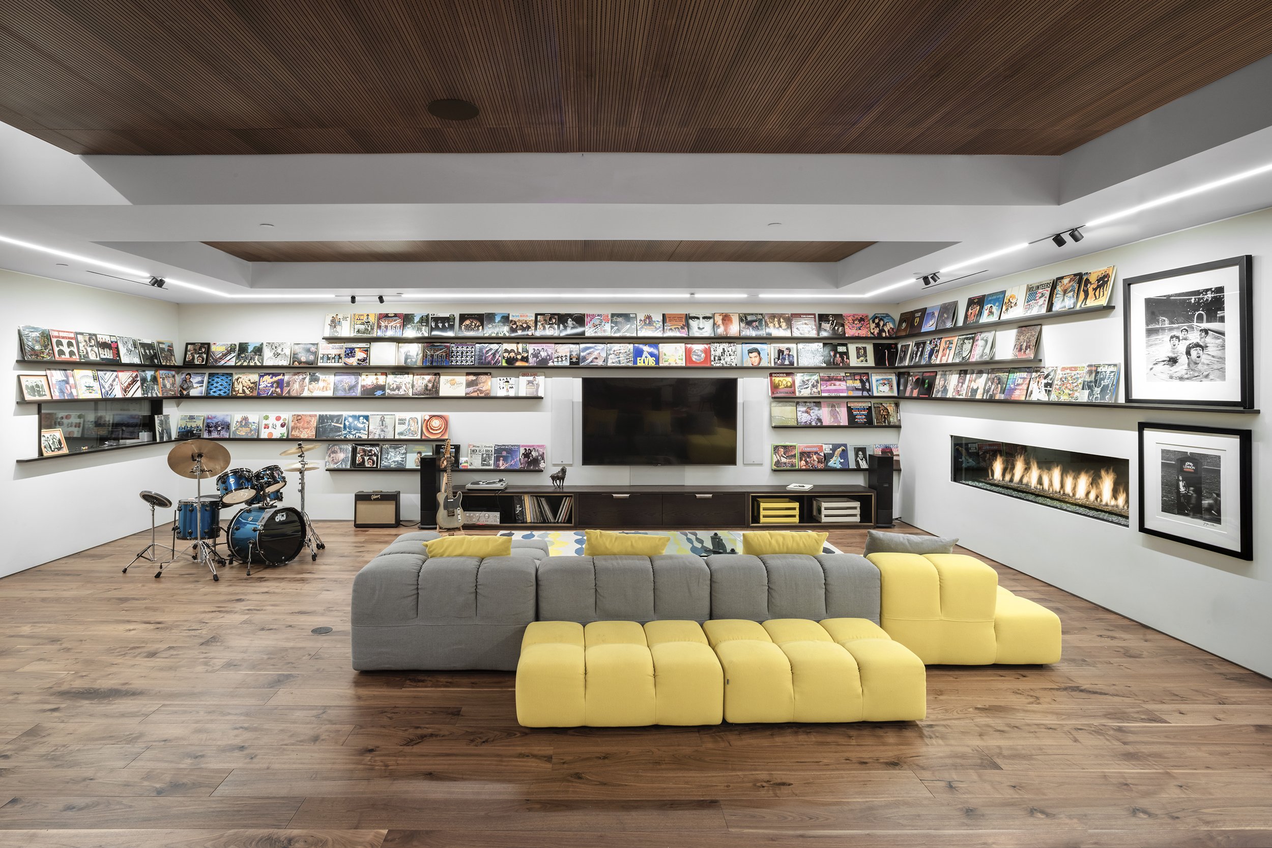 Movie lounge and music room with drum kit & modern interior design, at our Coral House in Santa Monica, California