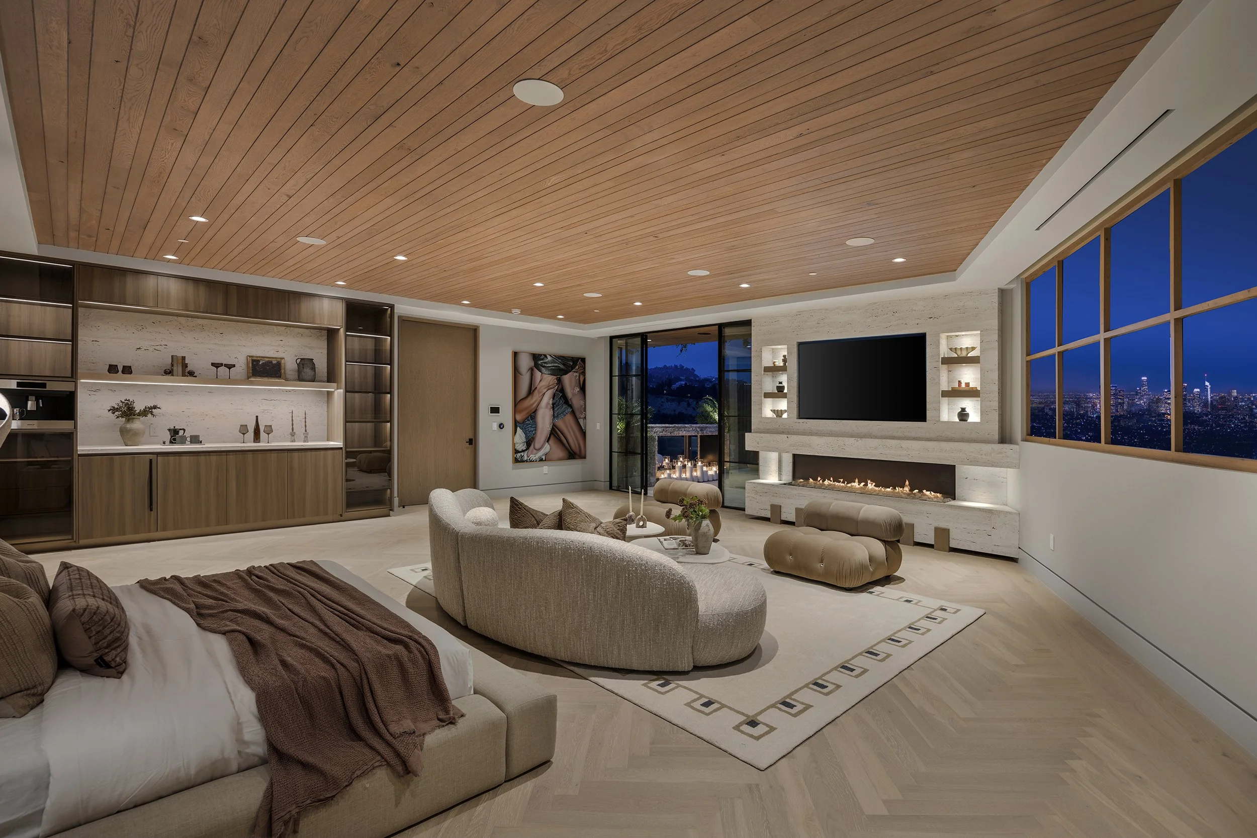 Laurel House Beverly Hills luxury home modern primary suite with fireplace at night
