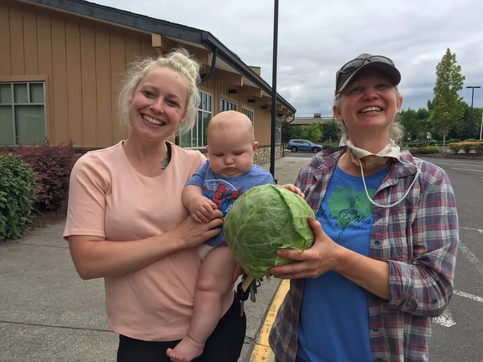 CSA Love  | Cheyene and Jamison are big fans of April Joy Farm cabbage.  We’re big fans of the extraordinary effort CSA parents like her put into providing healthy food choices for their families.  (Note, this photo was taken early this summer before the delta variant arrived on the scene.)