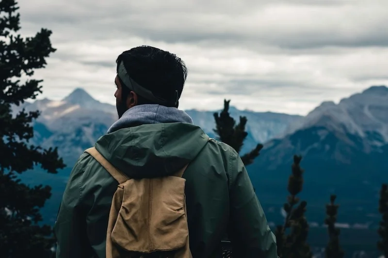 Person overlooking a mountain.