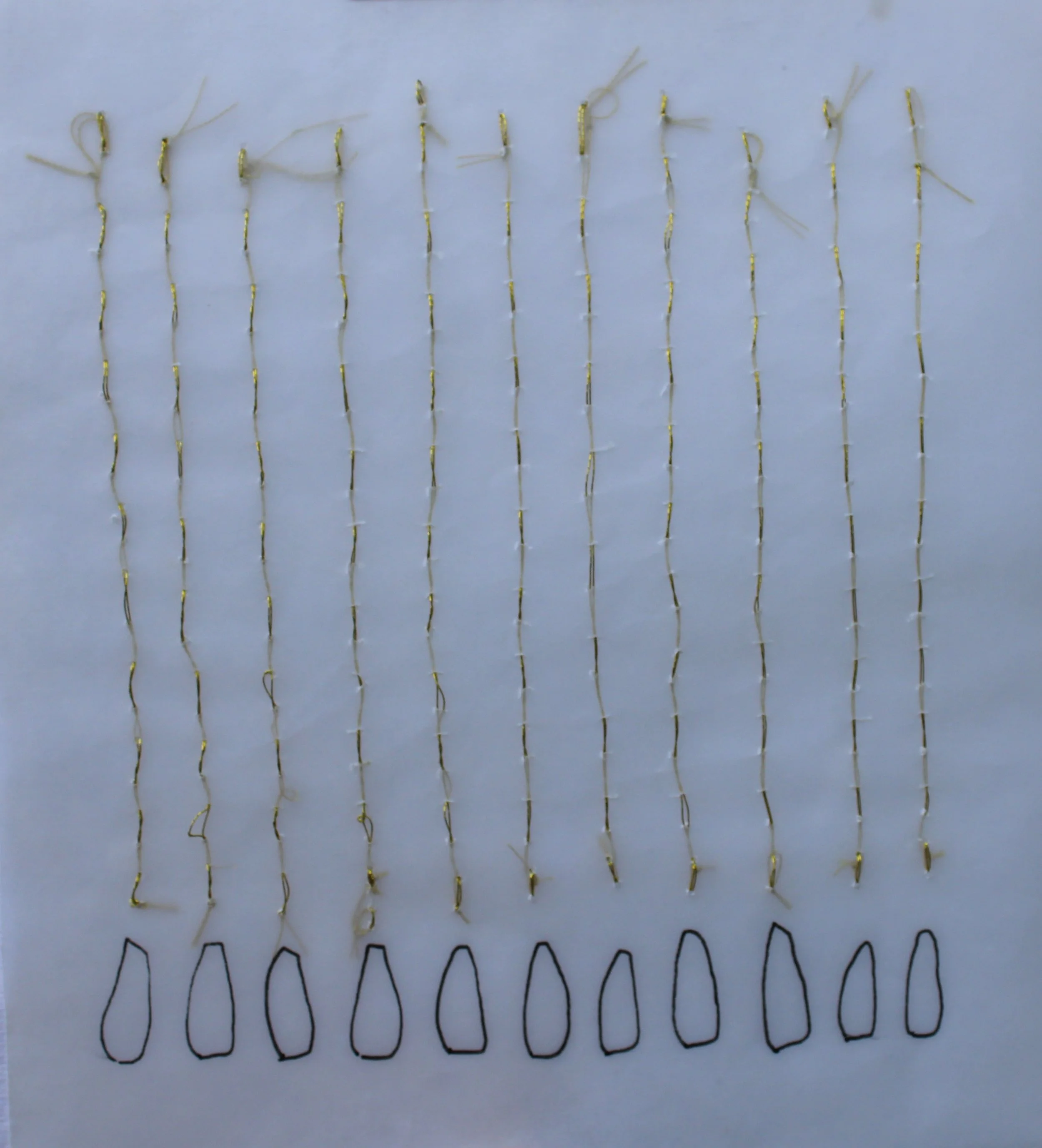 Replication. 2003. gold thread and pen on tracing paper. mounted on cotton paper. 14x15cm.JPG
