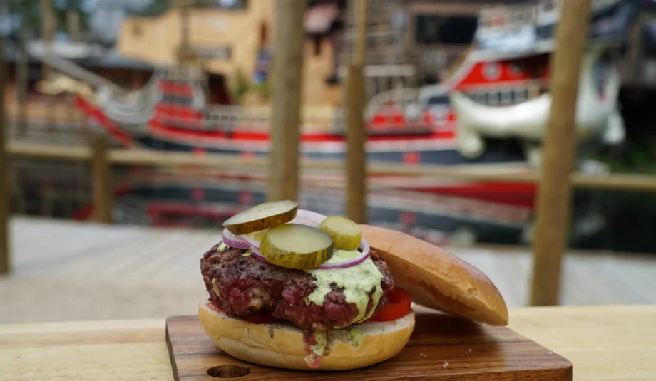 A hamburger is just pure meat, with a little salt and pepper added when cooked.