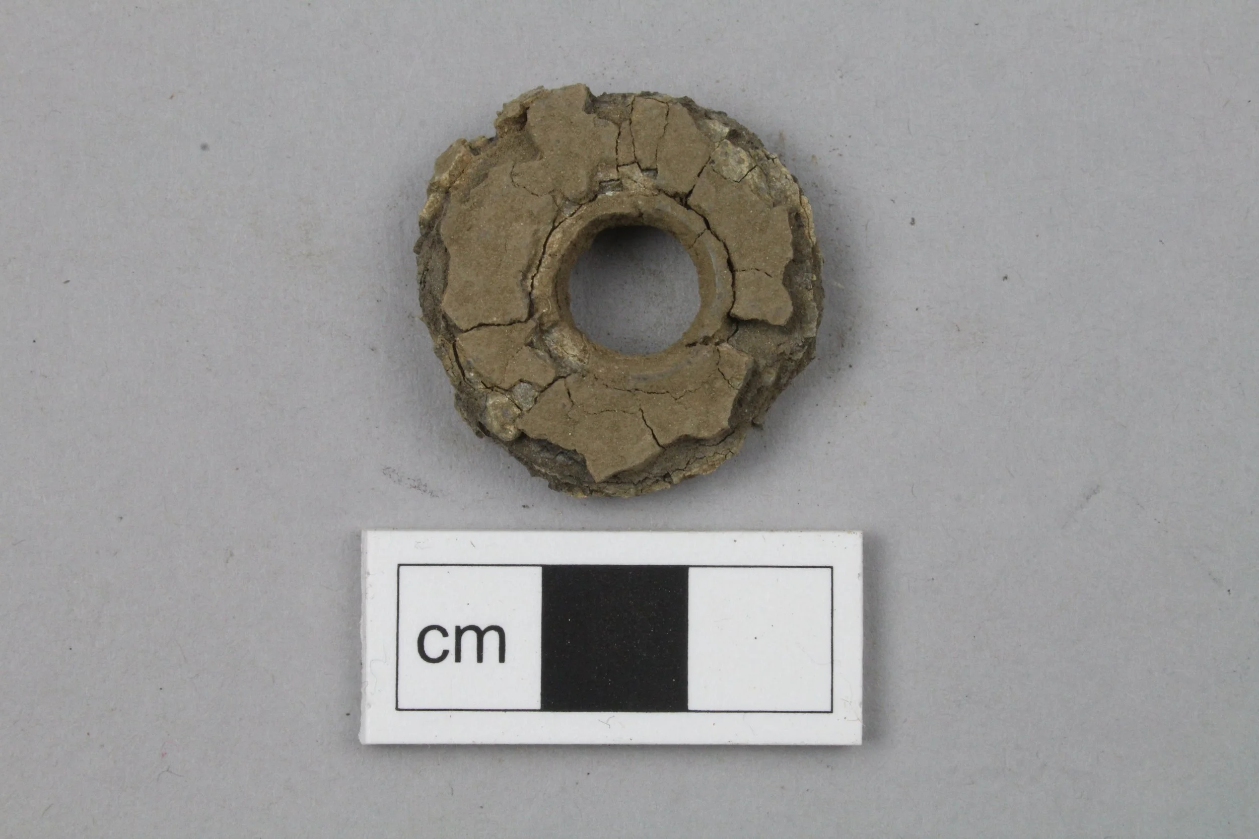 One of the spindle whorls before work began