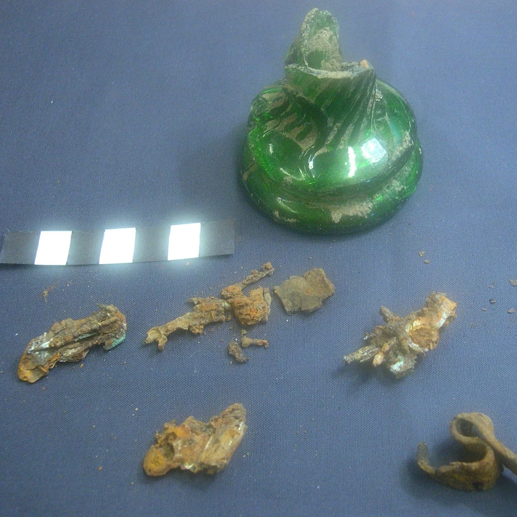 We're here: sliding in just under the wire for #FindsFriday, and combining it with the essence of #ArchaeologyAfterDark.
Excavations in 16th–18th century houses often reveal witch bottles — glass or ceramic vessels filled with pins, hai