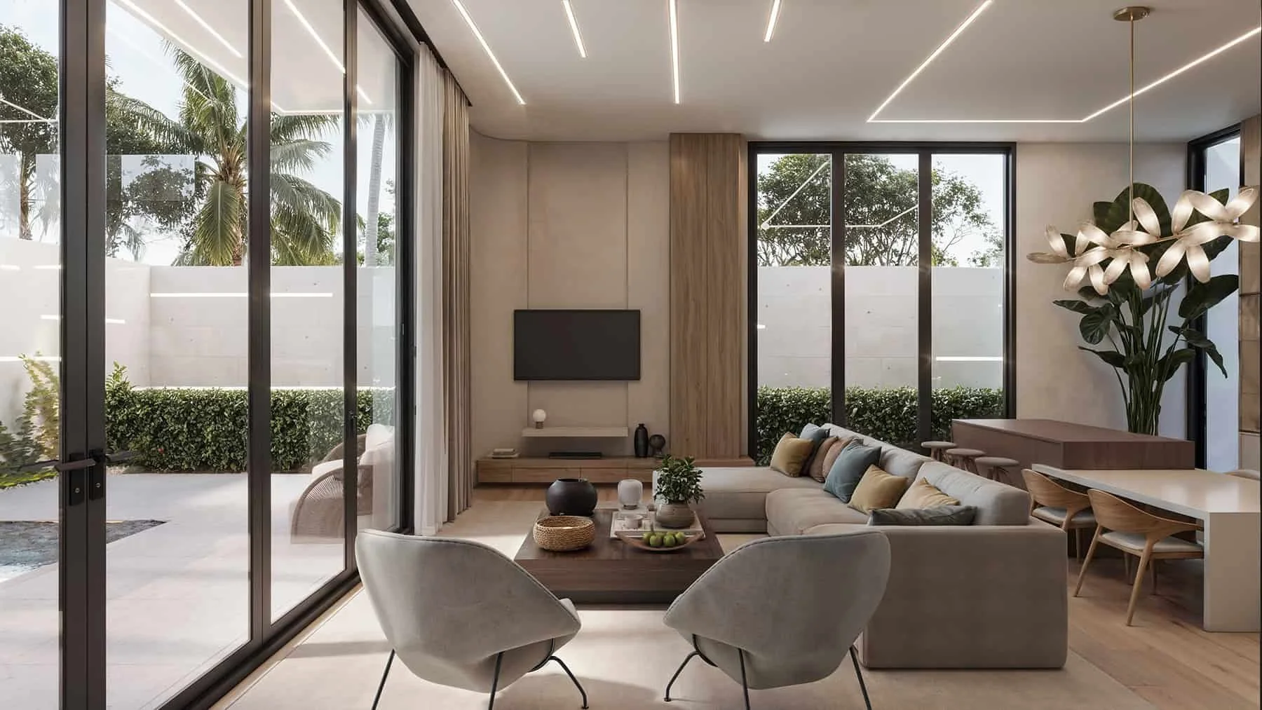 A bright, modern open-plan living room with large floor-to-ceiling sliding glass doors opening to an outdoor patio and pool area.