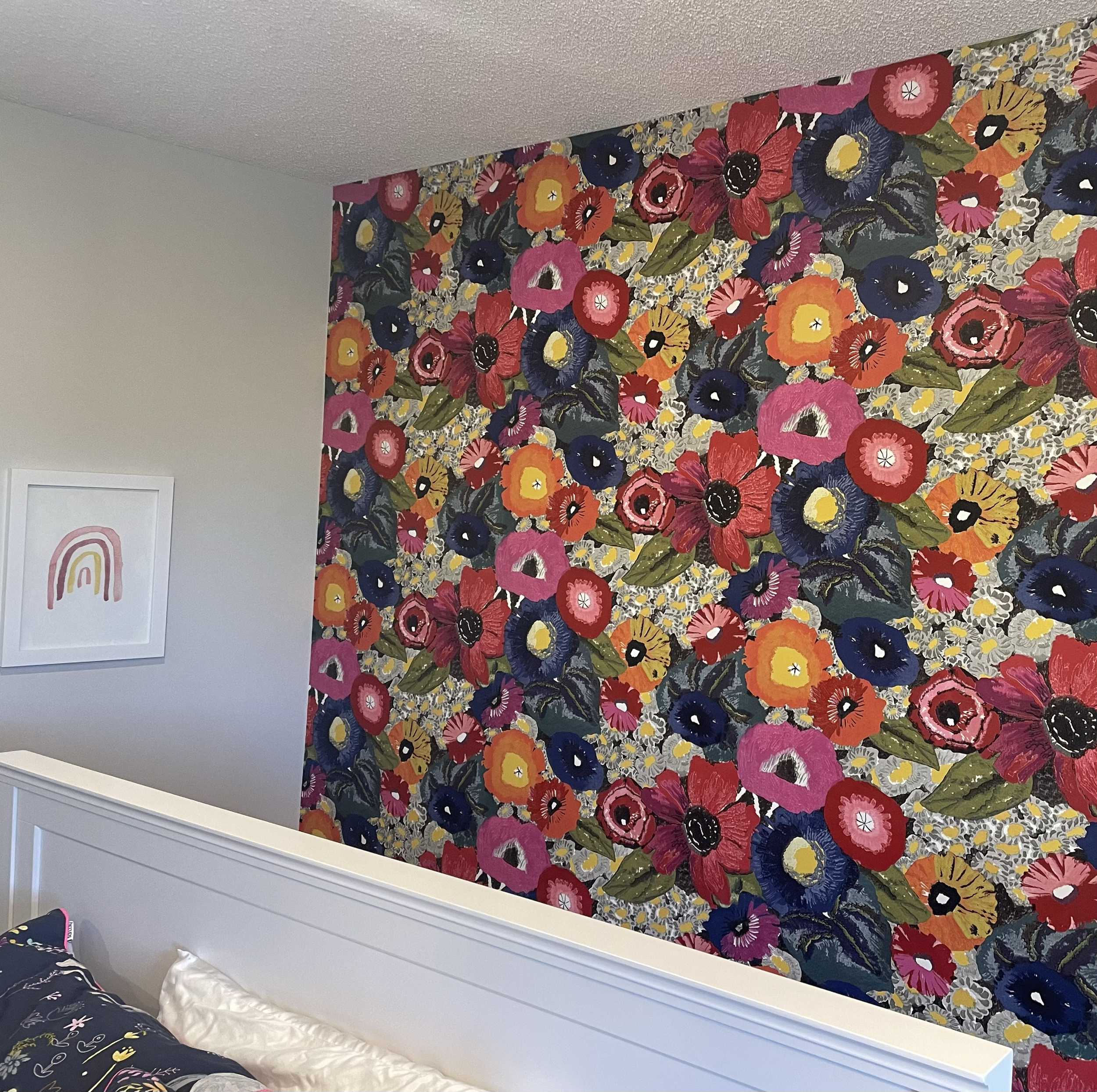 A bedroom with a large floral wallpaper. Office Wallpaper. Interior House Painting. Heather Feather Painting and Design. Toronto.