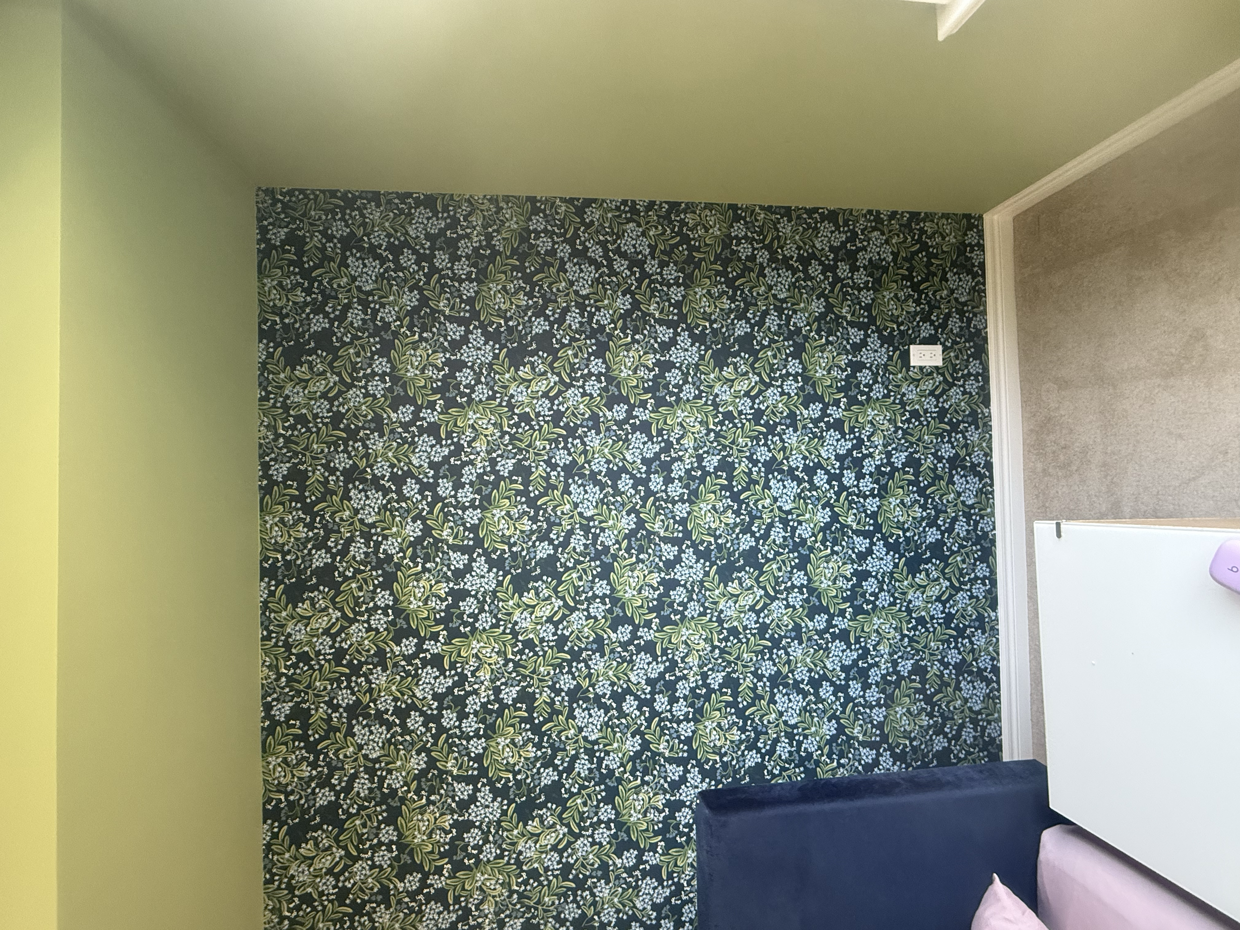 Interior room with yellow and floral wallpapered wall, white trim, and part of a white cabinet or appliance visible.
Wallpaper. Interior House Painting. Heather Feather Painting and Design. Toronto.