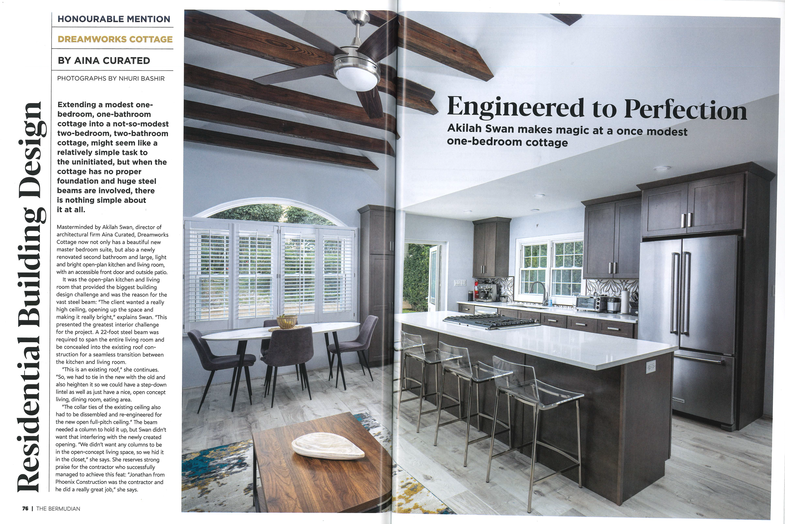 Magazine article featuring a modern kitchen and dining area with exposed wooden beams, kitchen island, and stainless steel appliances, highlighting a residential building design by Akilah Swan.