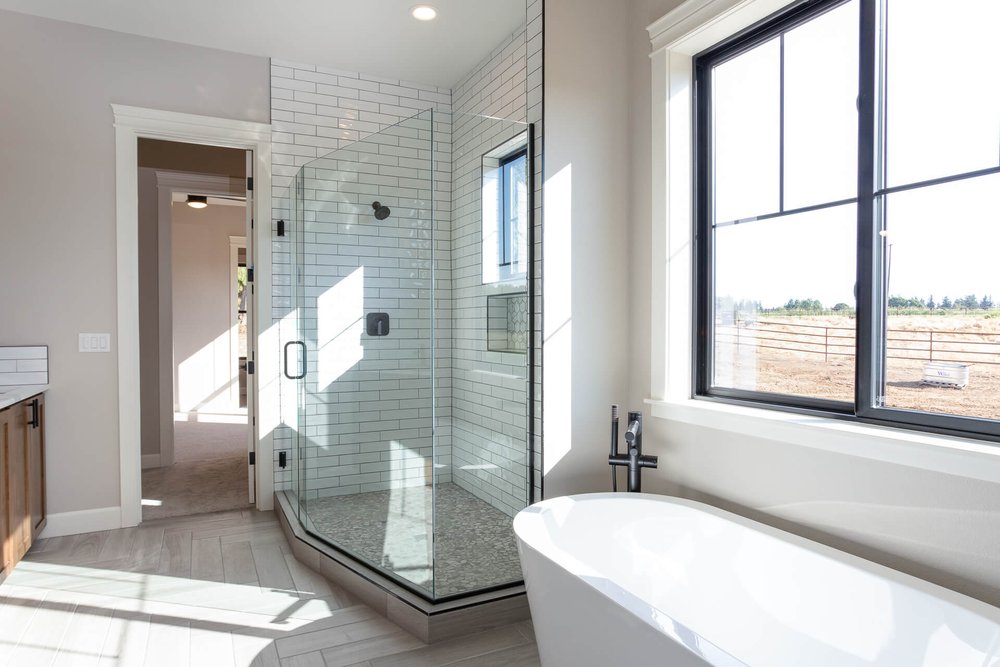 modern bathtub and shower in Adair Home master bathroom