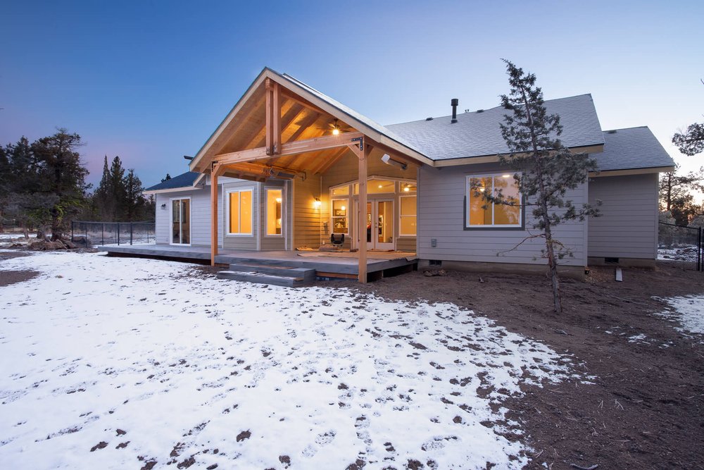 central Oregon Adair home in snow at twilight