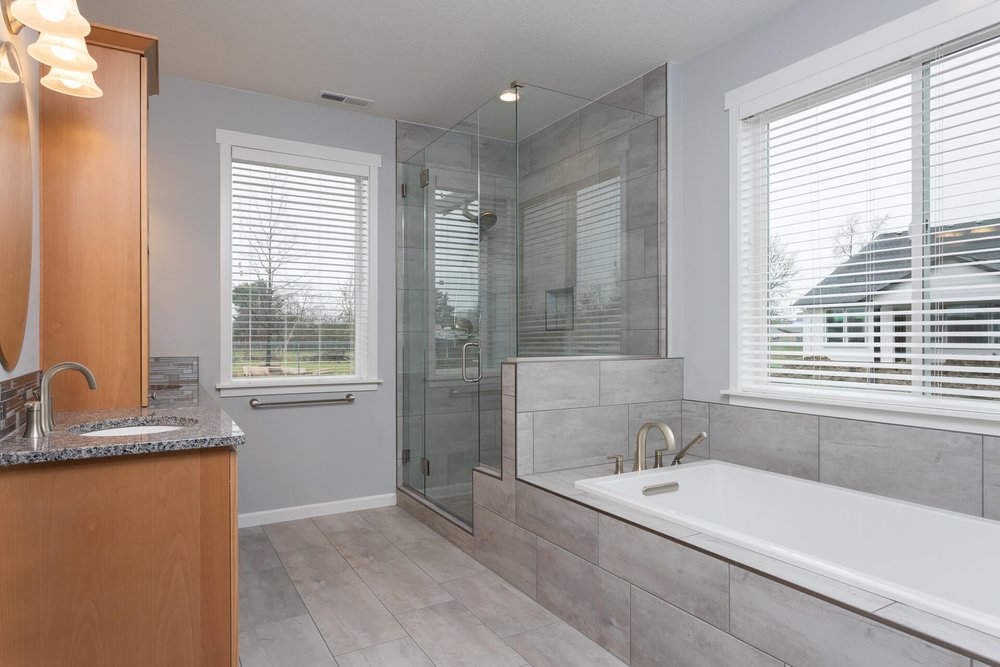 modern grey bathroom with glass shower and soaking tub albany oregon