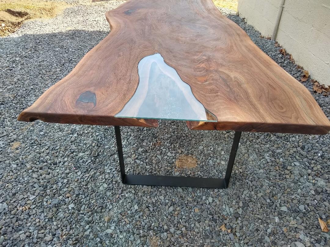 Live Edge Walnut Dining Table with glass inlay and steel legs.