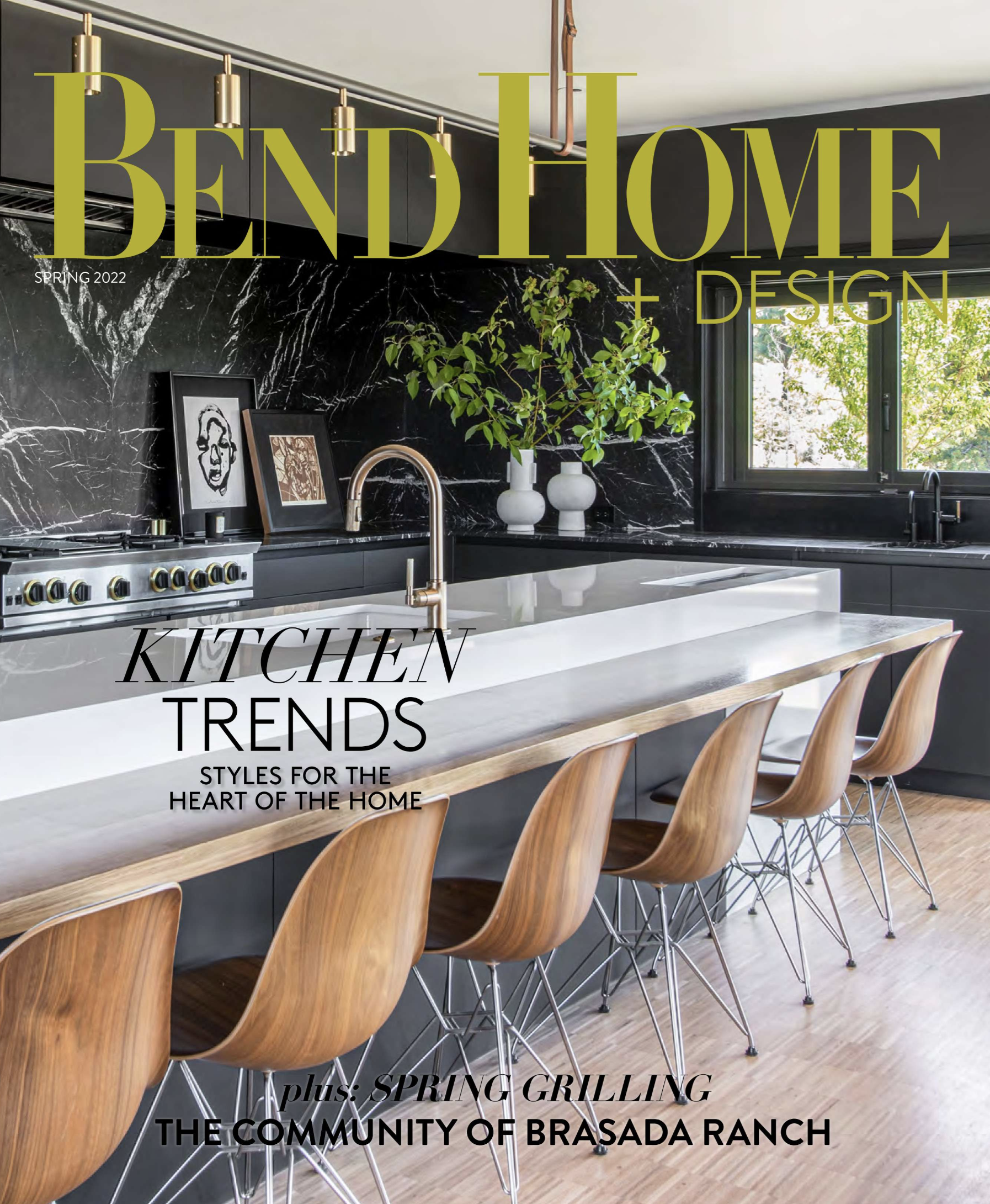 "Modern kitchen with black cabinetry marble backsplash and waterfall island in Bend Oregon custom home