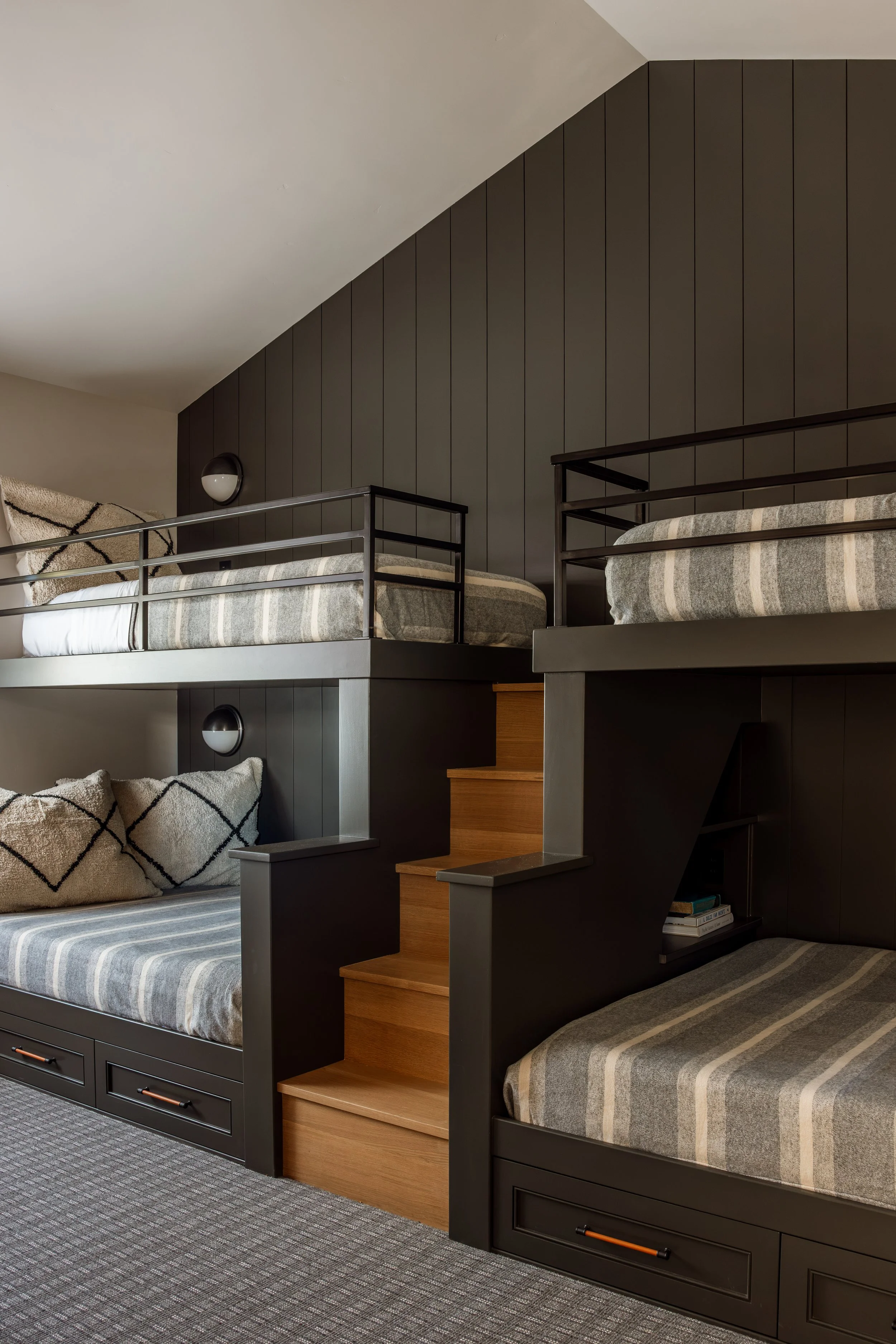 Built-in bunk room with steps and storage drawers.