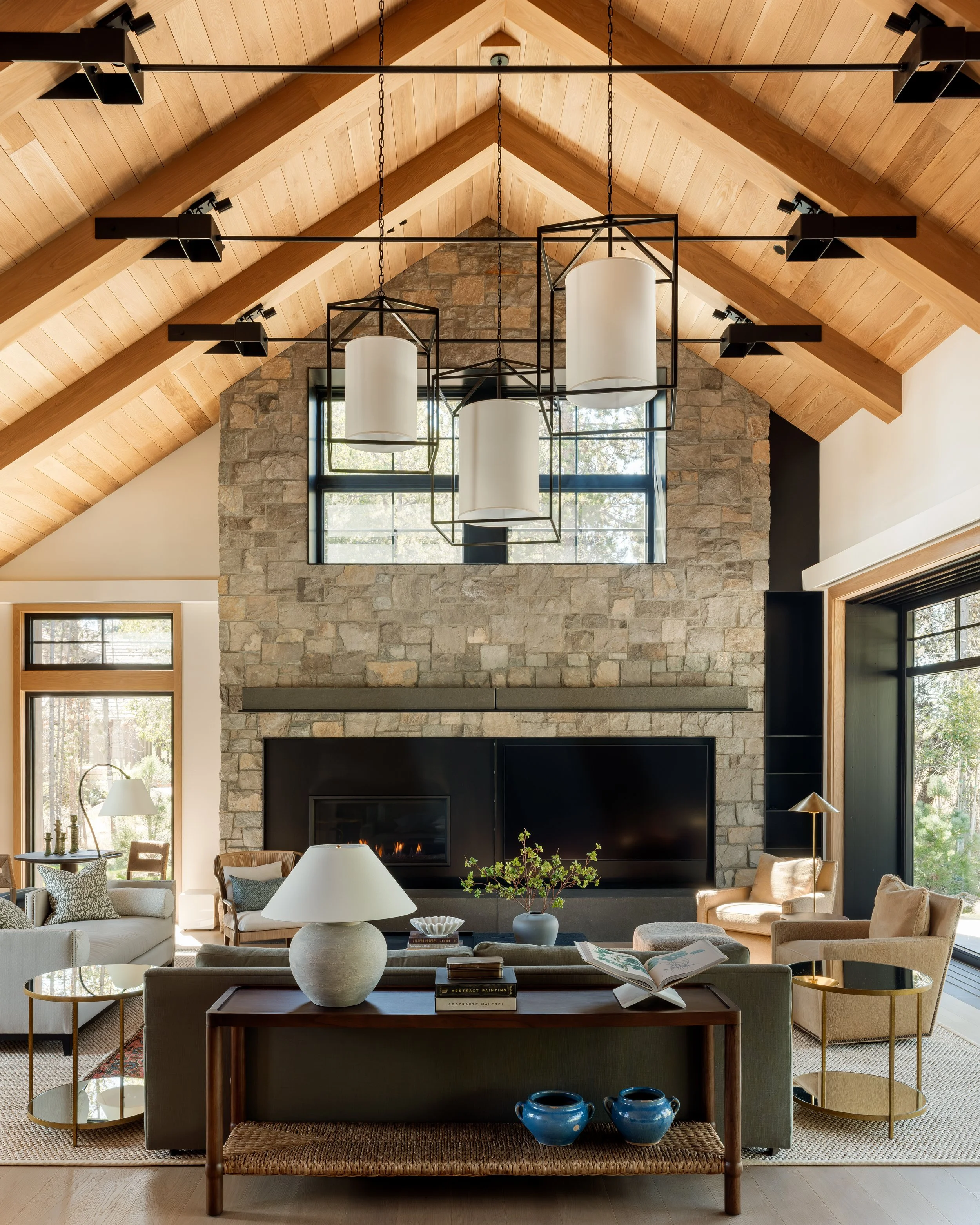 Living room with a floor-to-ceiling stacked stone fireplace.