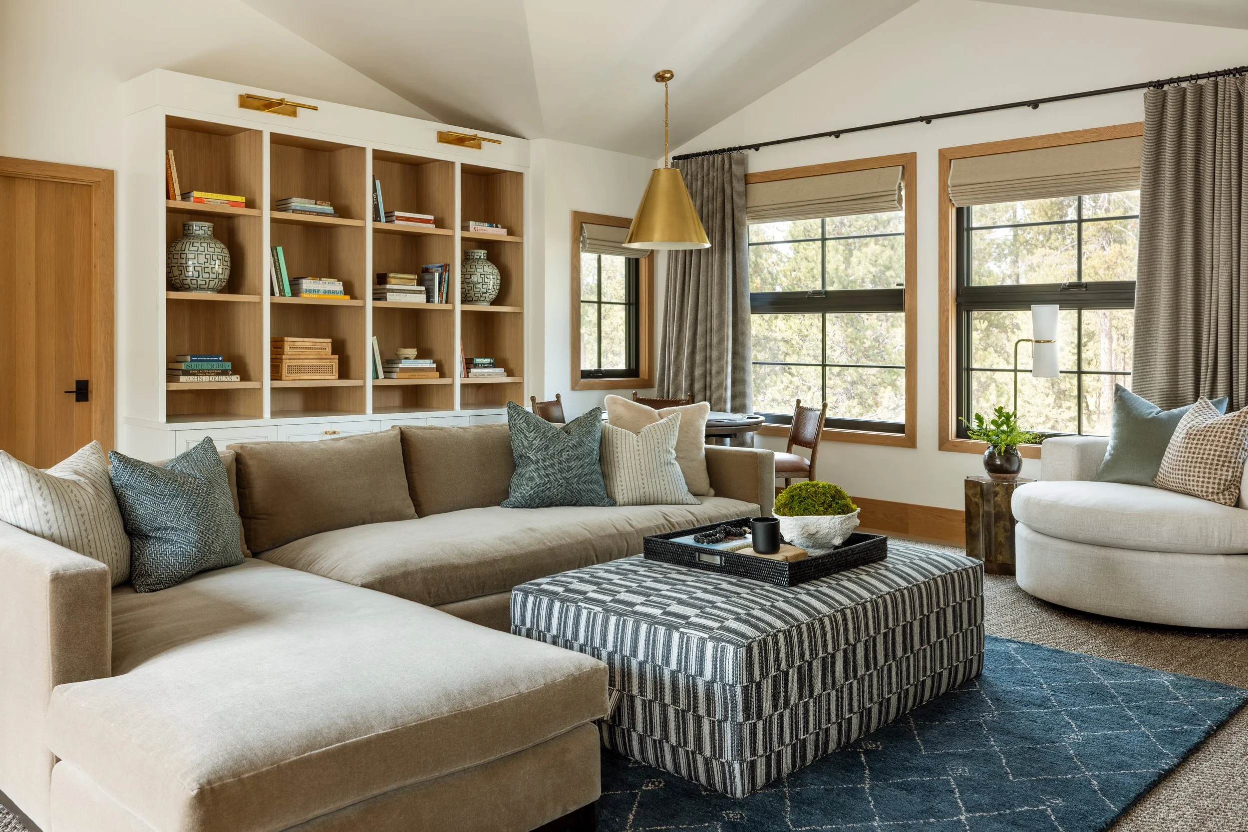 Upstairs loft family room with built-in shelving.