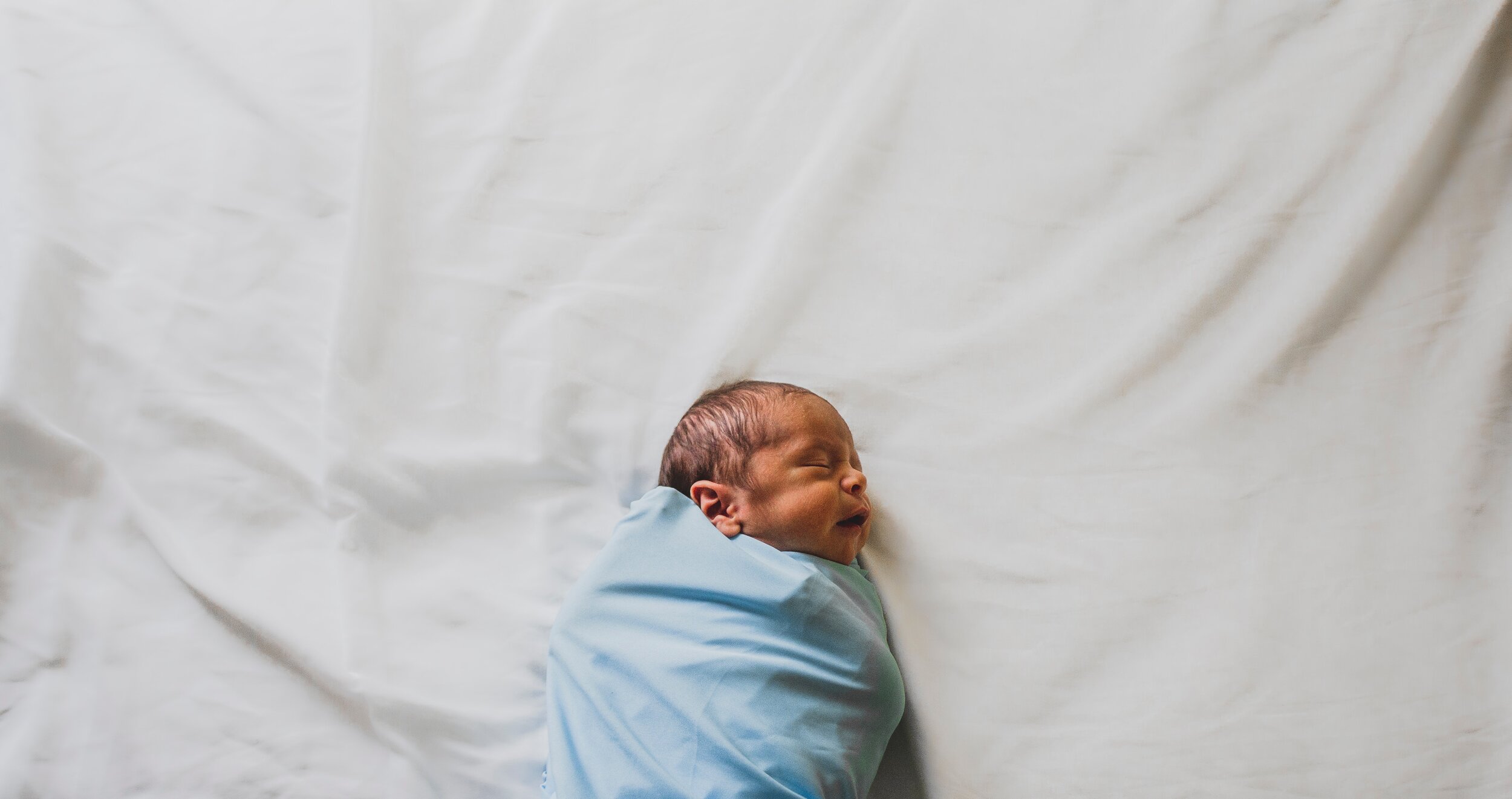 photo-of-new-born-baby-covered-with-blue-blanket-3617843.jpg
