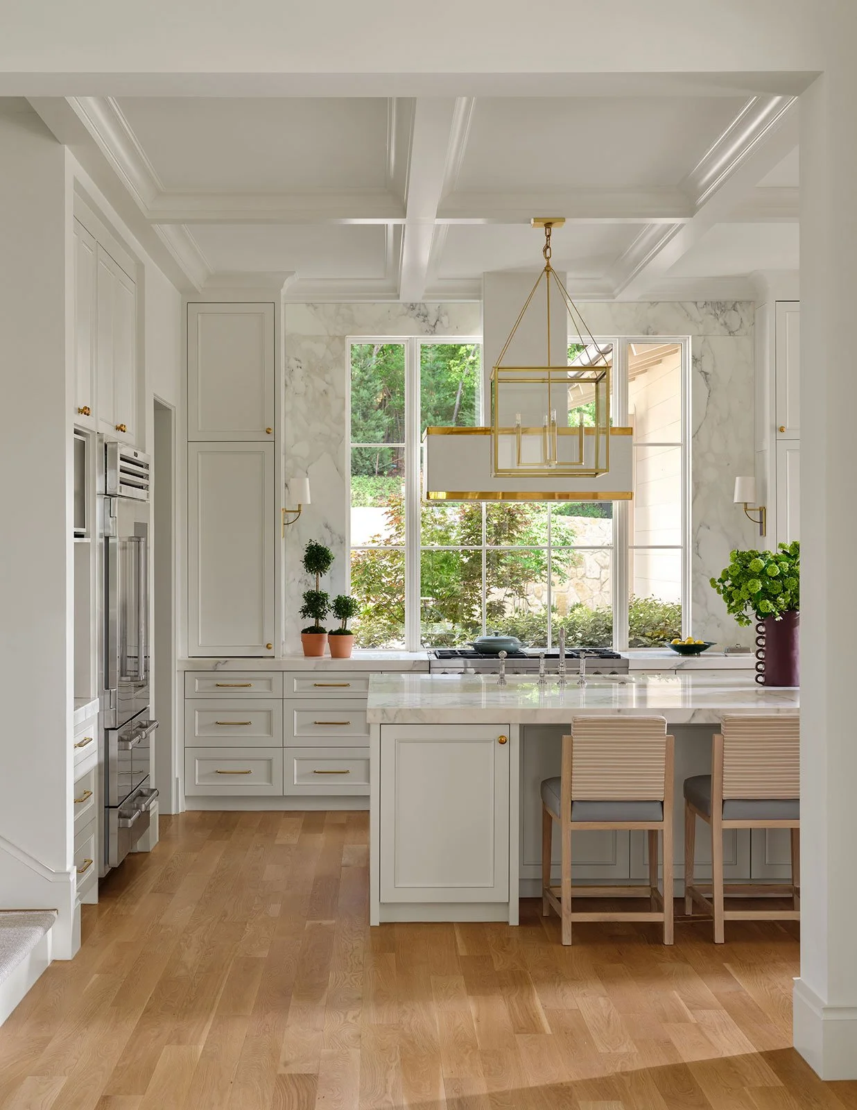 9. Fort_Worth_Home_Kitchen_with_Custom_Cabinetry_and_Large_Format_Stone_Backsplash_Surrounding_Windows.jpg