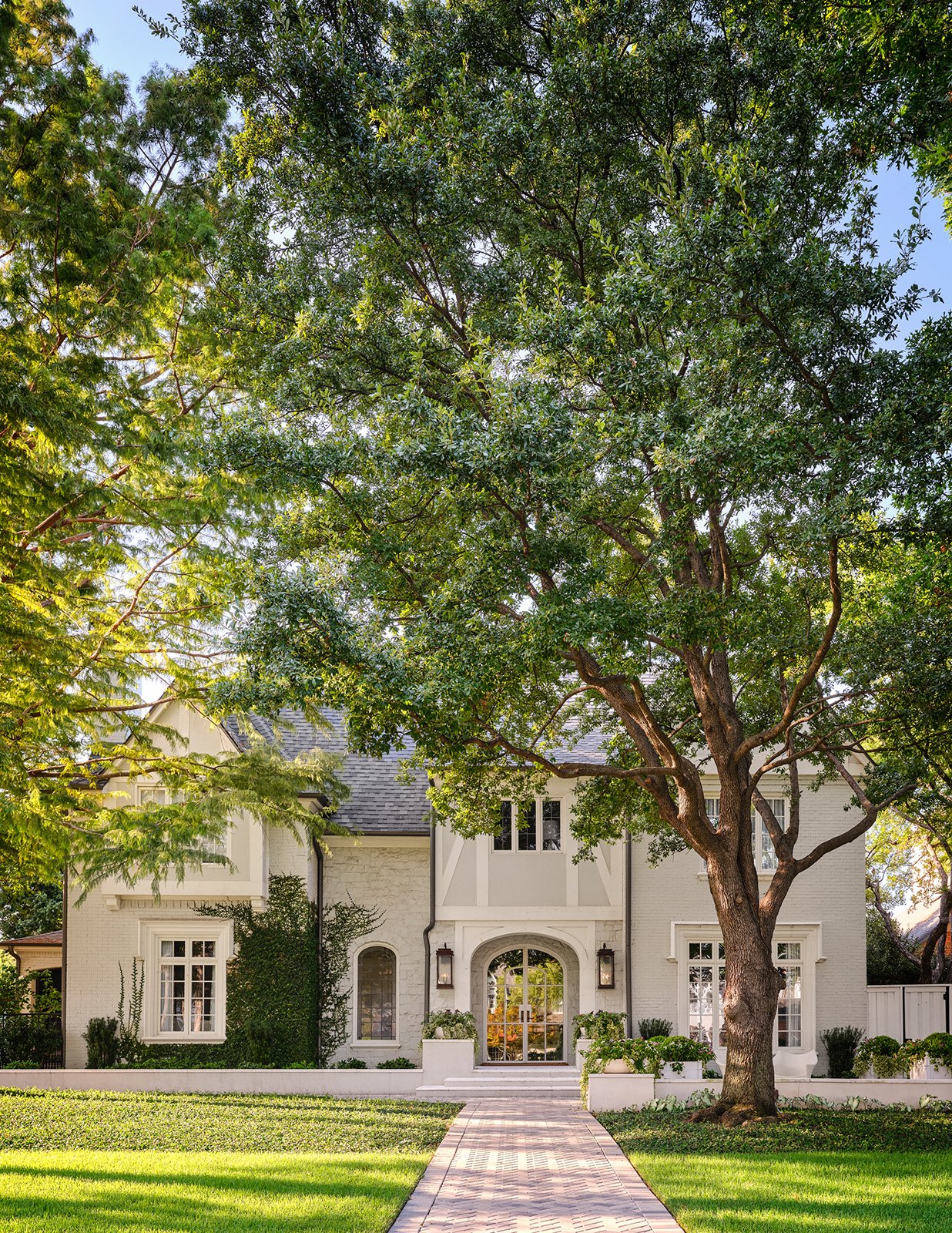 Front_Exterior_with_Big_Trees_and_a_Stone_Path.jpg