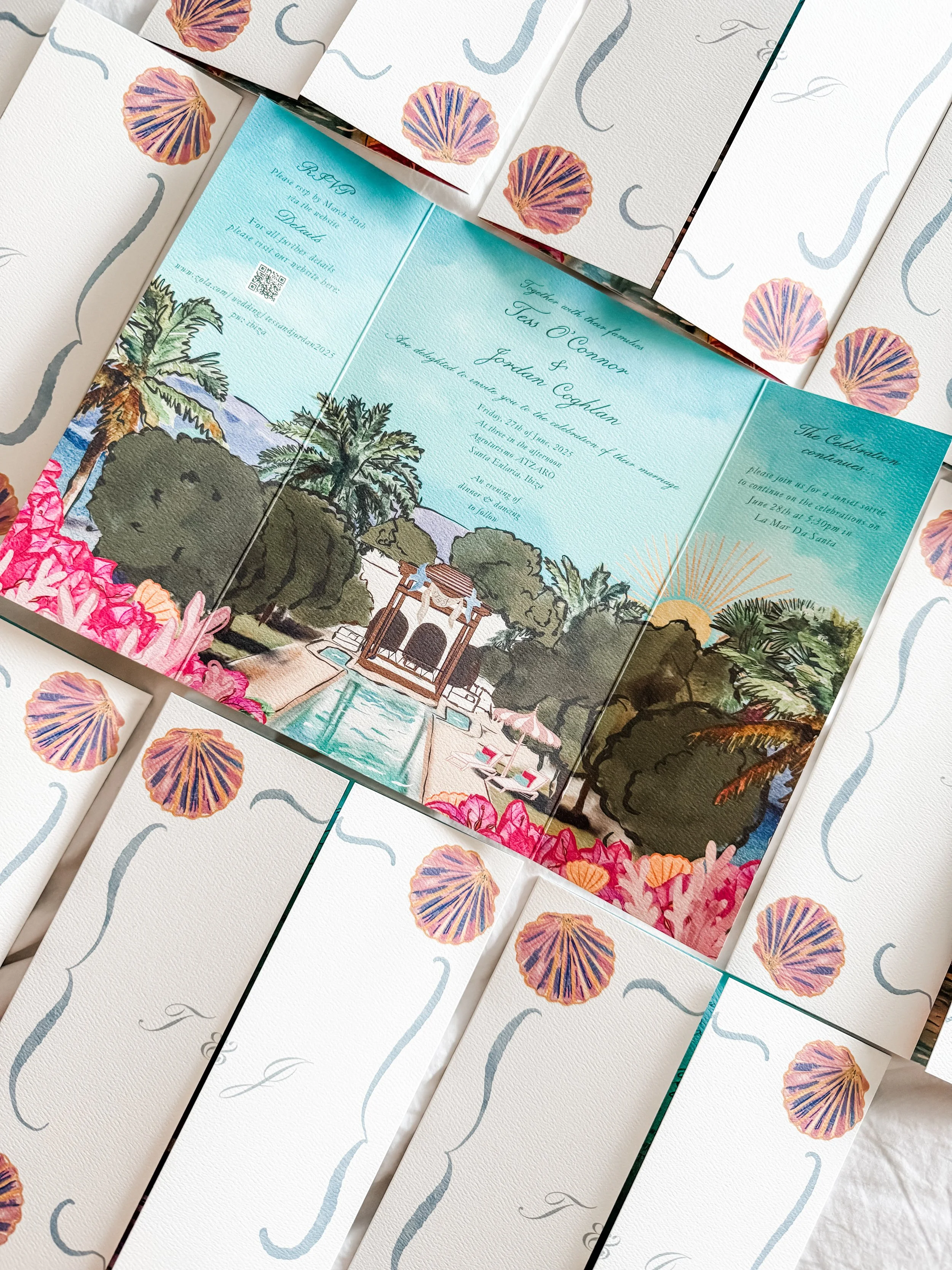 Colorful wedding invitation with a tropical theme featuring palm trees, lush greenery, and sunset scenery, surrounded by seashell illustrations.
