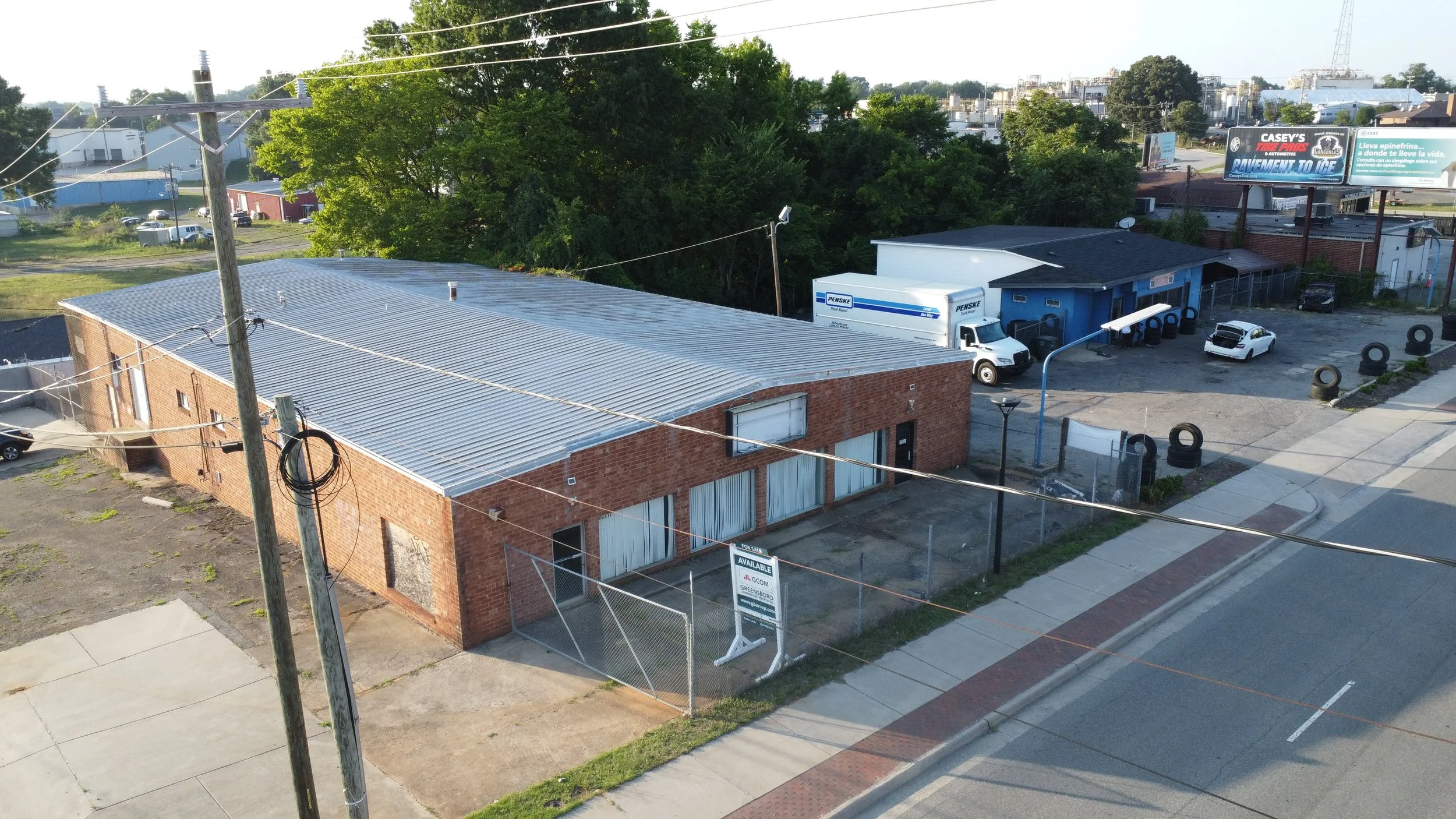 Freestanding commercial building for sale across from Greensboro Coliseum Complex suitable for retail, showroom, office, service, entertainment, or specialty commercial uses