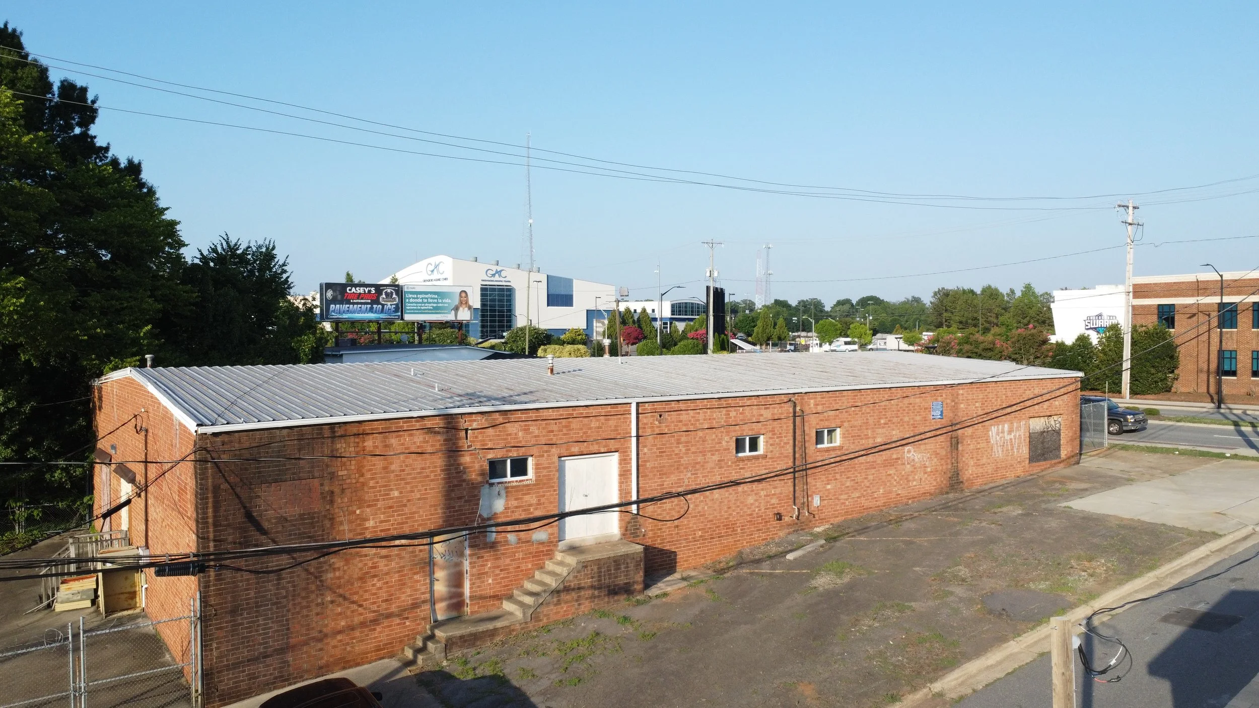 Freestanding commercial building for sale across from Greensboro Coliseum Complex suitable for retail, showroom, office, service, entertainment, or specialty commercial uses