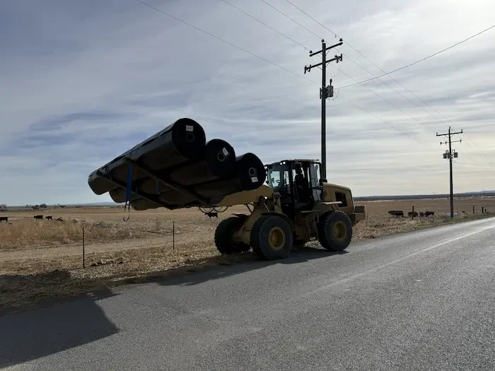 A construction crew moving geomembrane liner for a canal lining project in Twin Falls, ID.