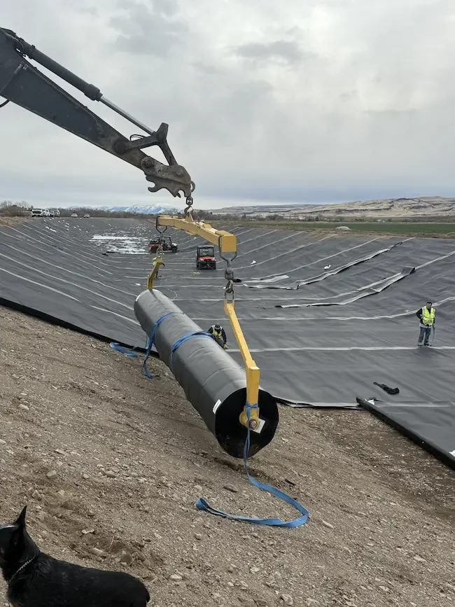 Geosynthetic installers laying geomembrane liner for a project in Twin Falls, ID