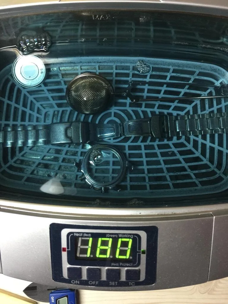 Watch in ultrasonic cleaning.jpeg