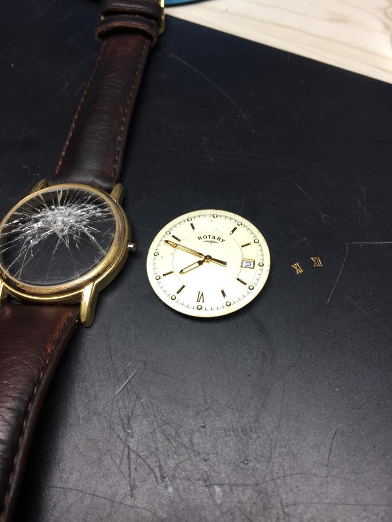 Rotary watch inside. Glass smashed..jpeg