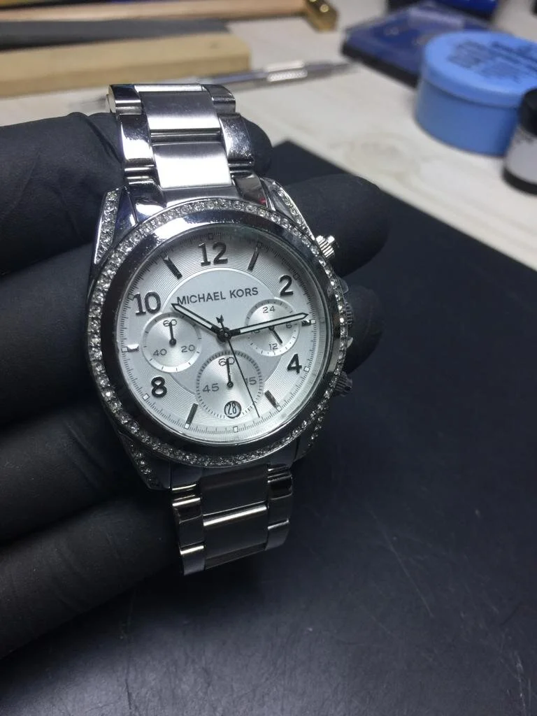 Michael Kors watch MK 5185 in for battery, reseal, new stones, clean and polish. Watch repairs in Peterborough.