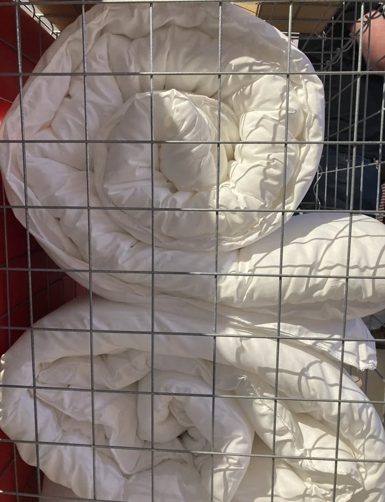 Bedding in exhibit donated to hostel after show.jpg
