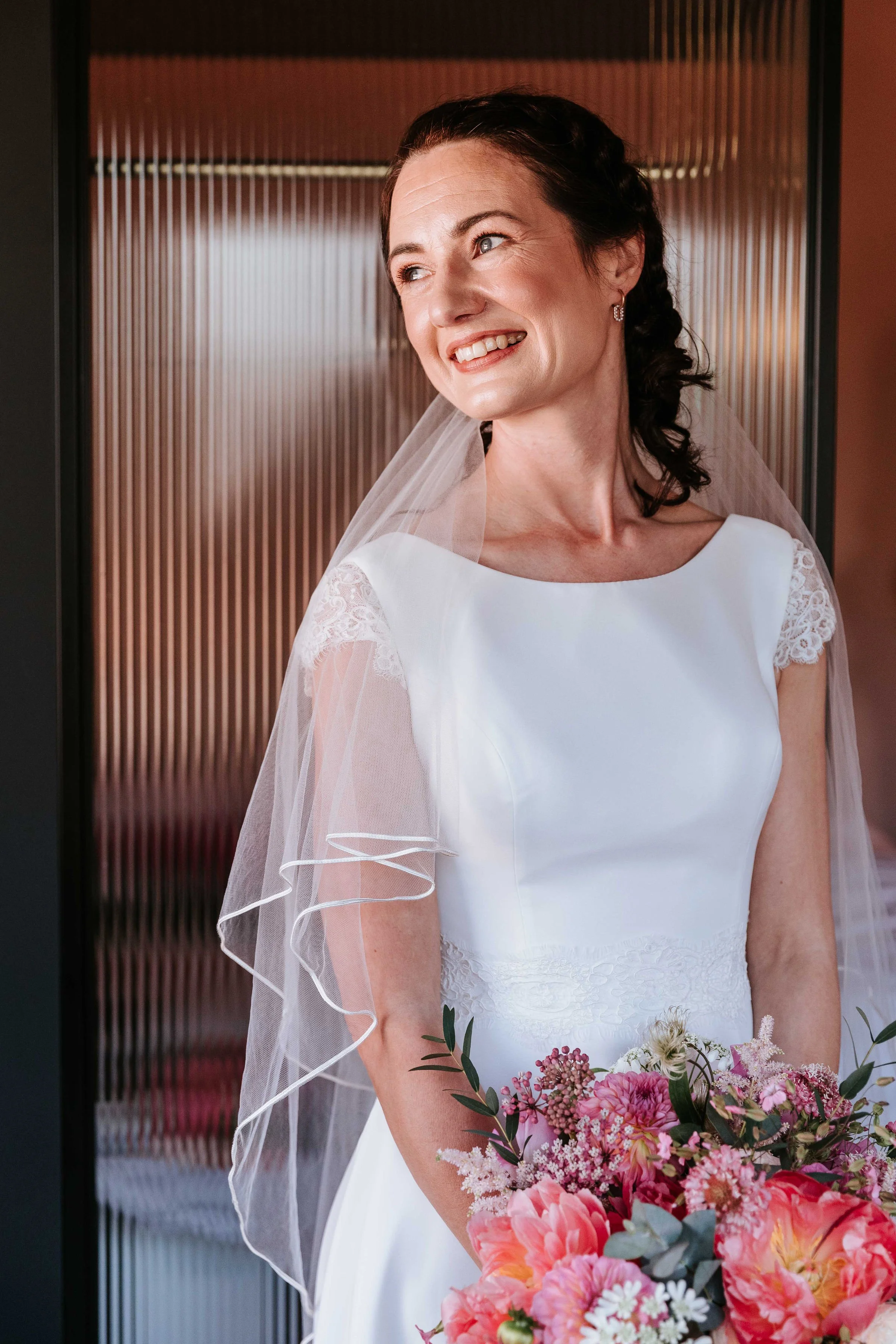 Smiling bride. Glowing makeup. Natural look