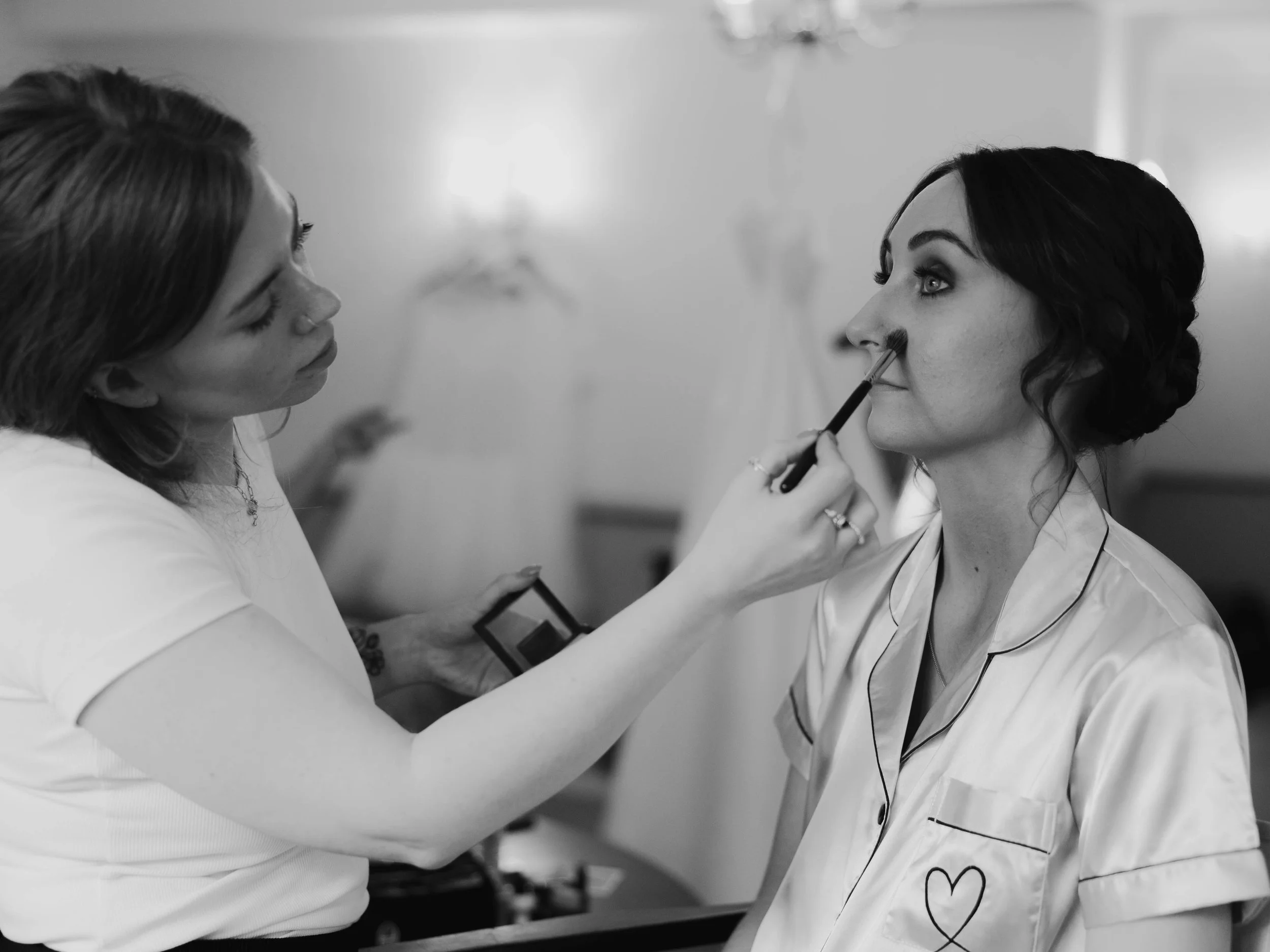 Makeup artist applying makeup