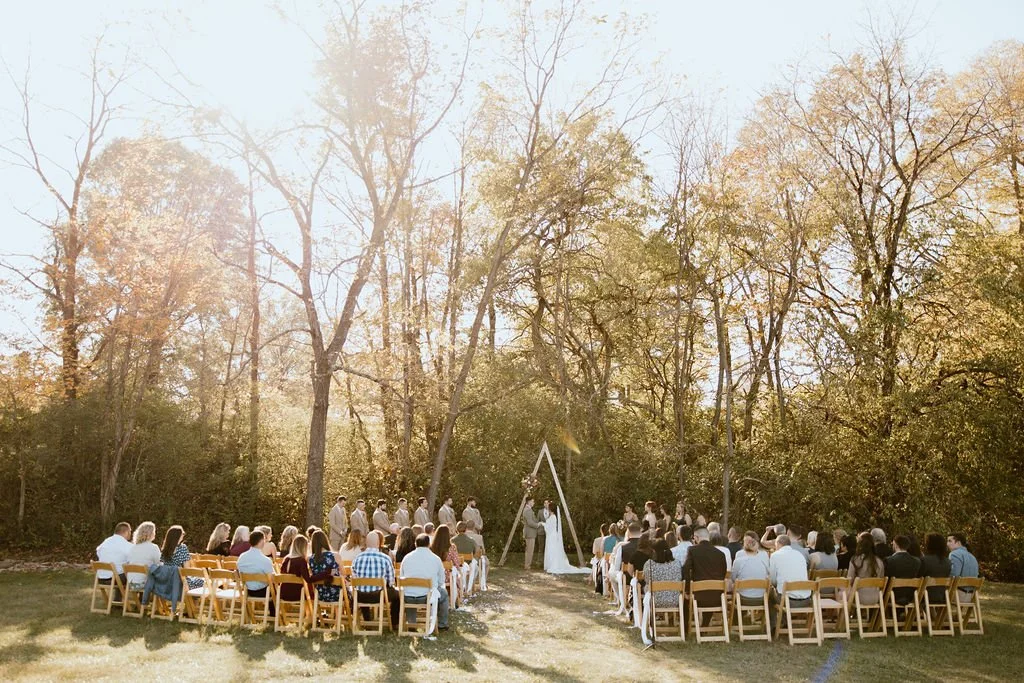 Creekside wedding ceremony at Cedar Bay Farm, a top-rated venue in Lebanon Ohio.