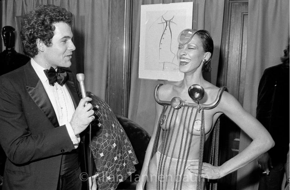 R. Couri Hay interviews a model wearing Rudi Gernreich's bicycle parts © Allan Tannenbaum 