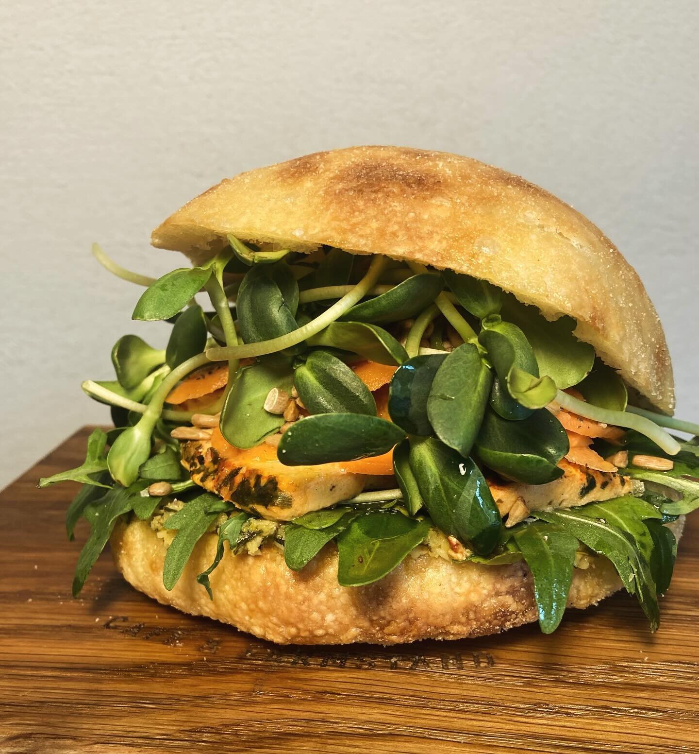 New menu item! FILLED FOCACCIA! 
Grilled Olive Tapenade, Rocket Salad, Cashew Cheeze (bruschetta flavour), Chilli Pickled Carrots, Sunflower Shoots &amp; Roasted Sunflower Seeds in a Perfectly fluffy Focaccia bun! 💥 

Yeah it&rsquo;s as good as it s