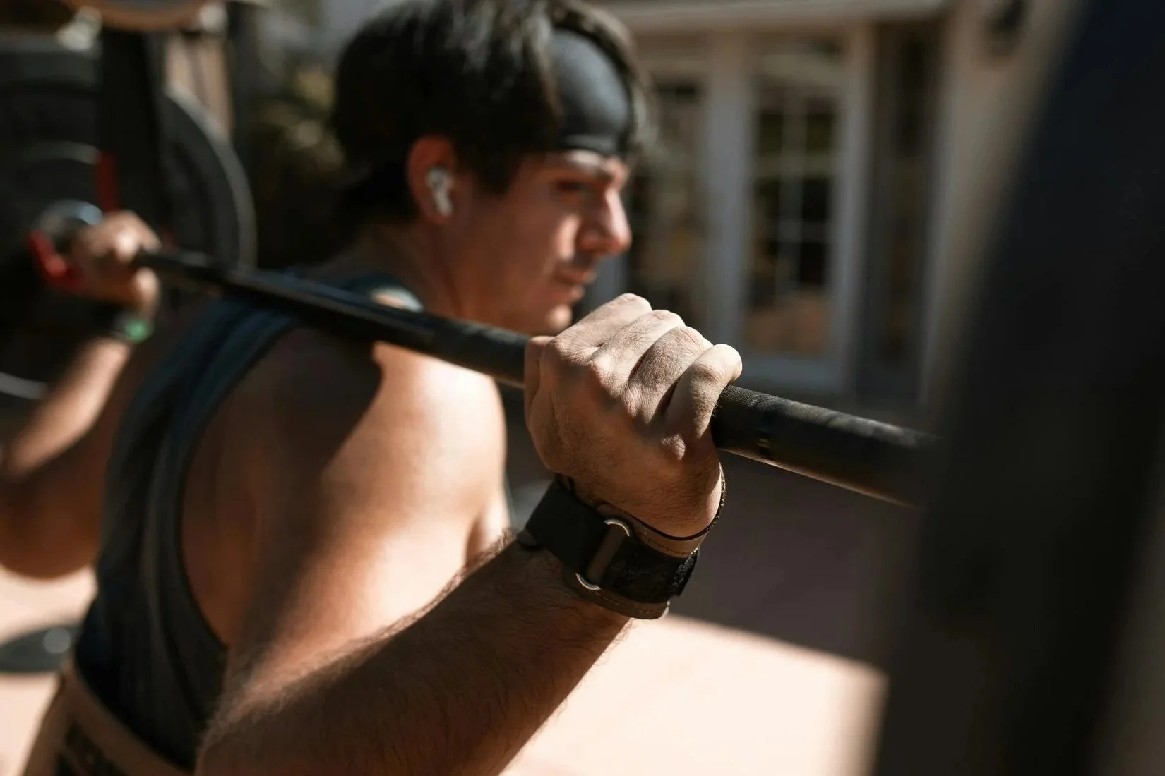 a weightlifter using headphones to create boundaries