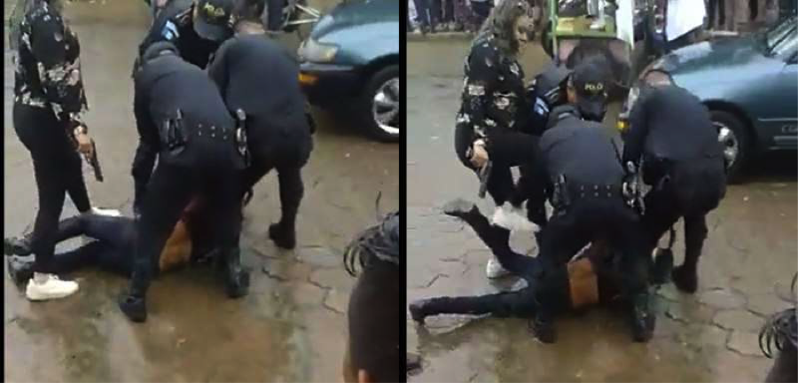 Who is the woman with the gun, attacking - with the Guatemalan police - a Q'eqchi' villager from El Estor?