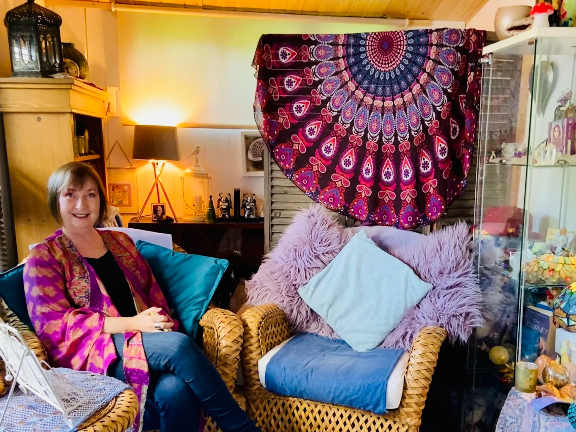Nicky Williams sits in her healing space near Bridport Dorset