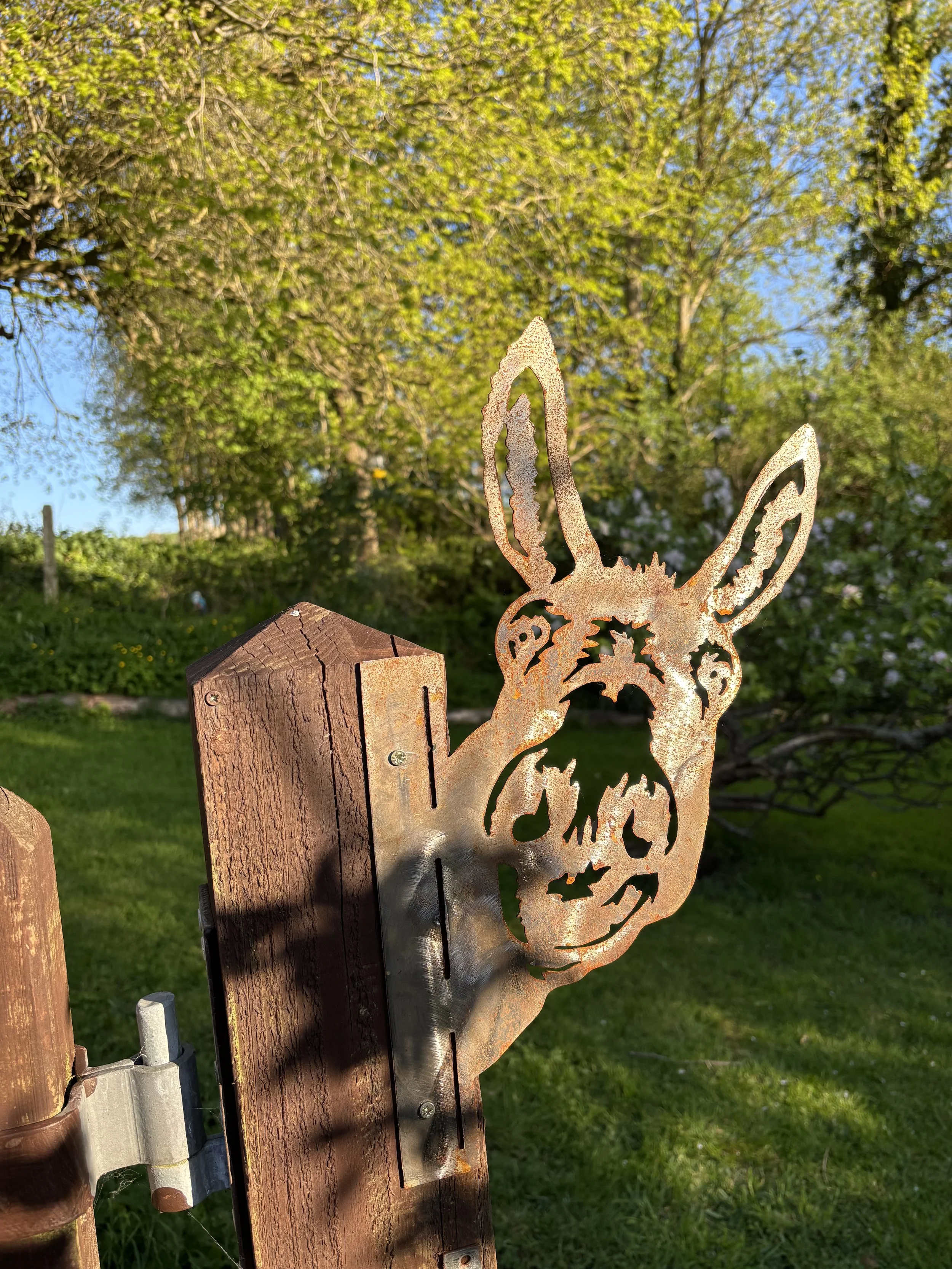 Decorative metal donkey sign outside the self-catering accommodation near Bridport
