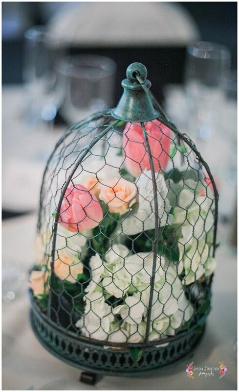  rustic flower centerpiece in a wire bird cage 